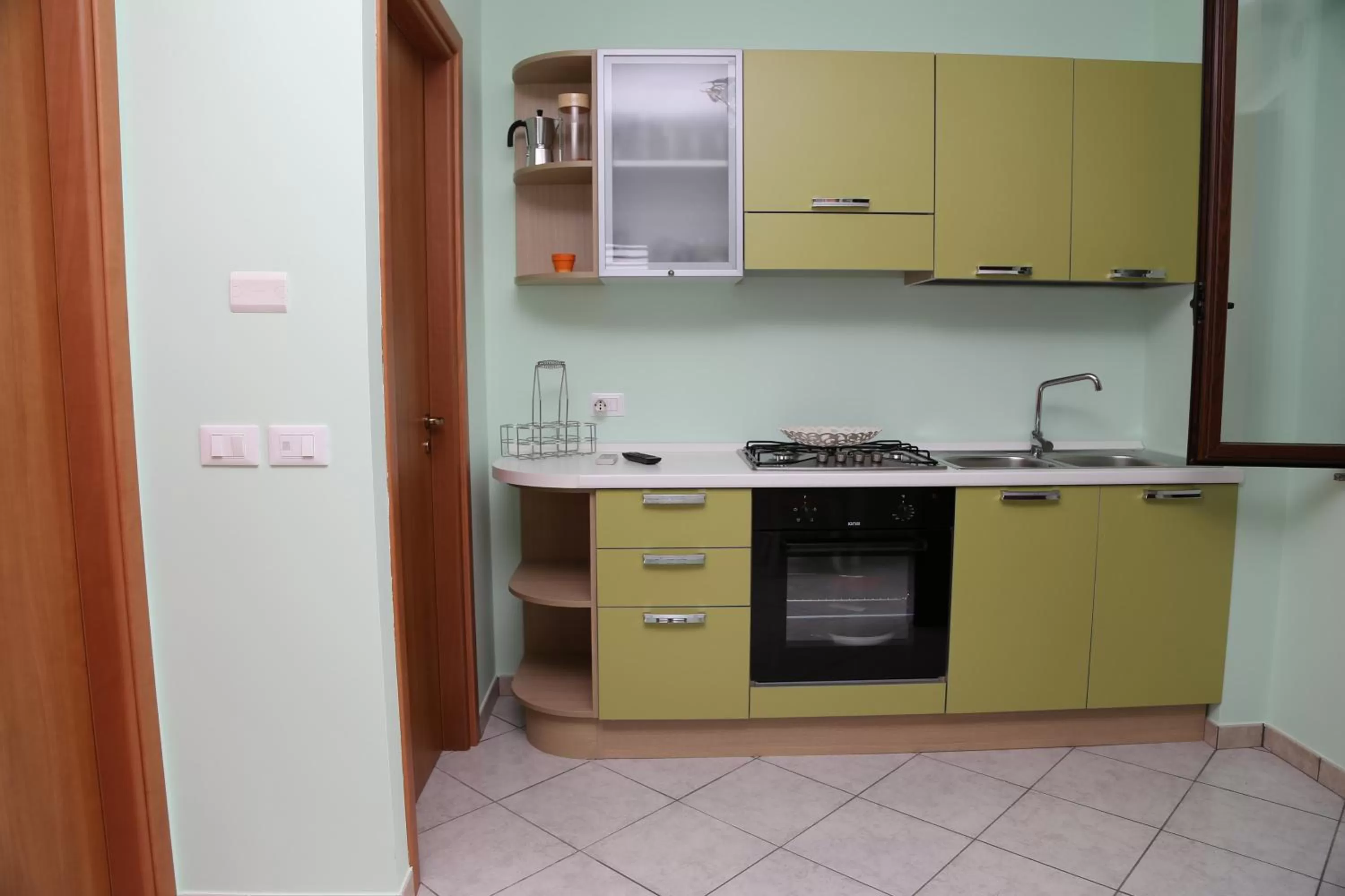 Kitchen or kitchenette in Appartamenti Anzà
