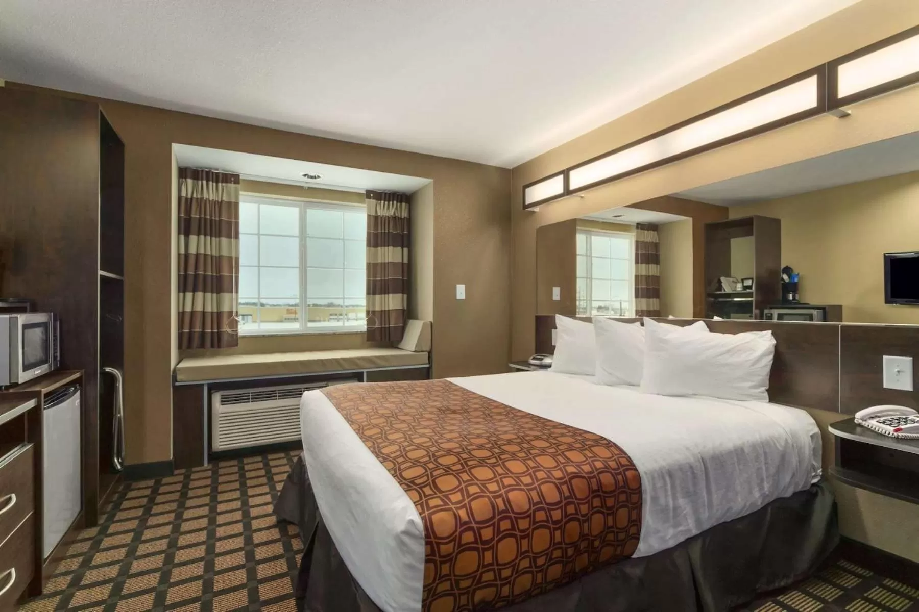 Bed in Microtel Inn & Suites by Wyndham Minot