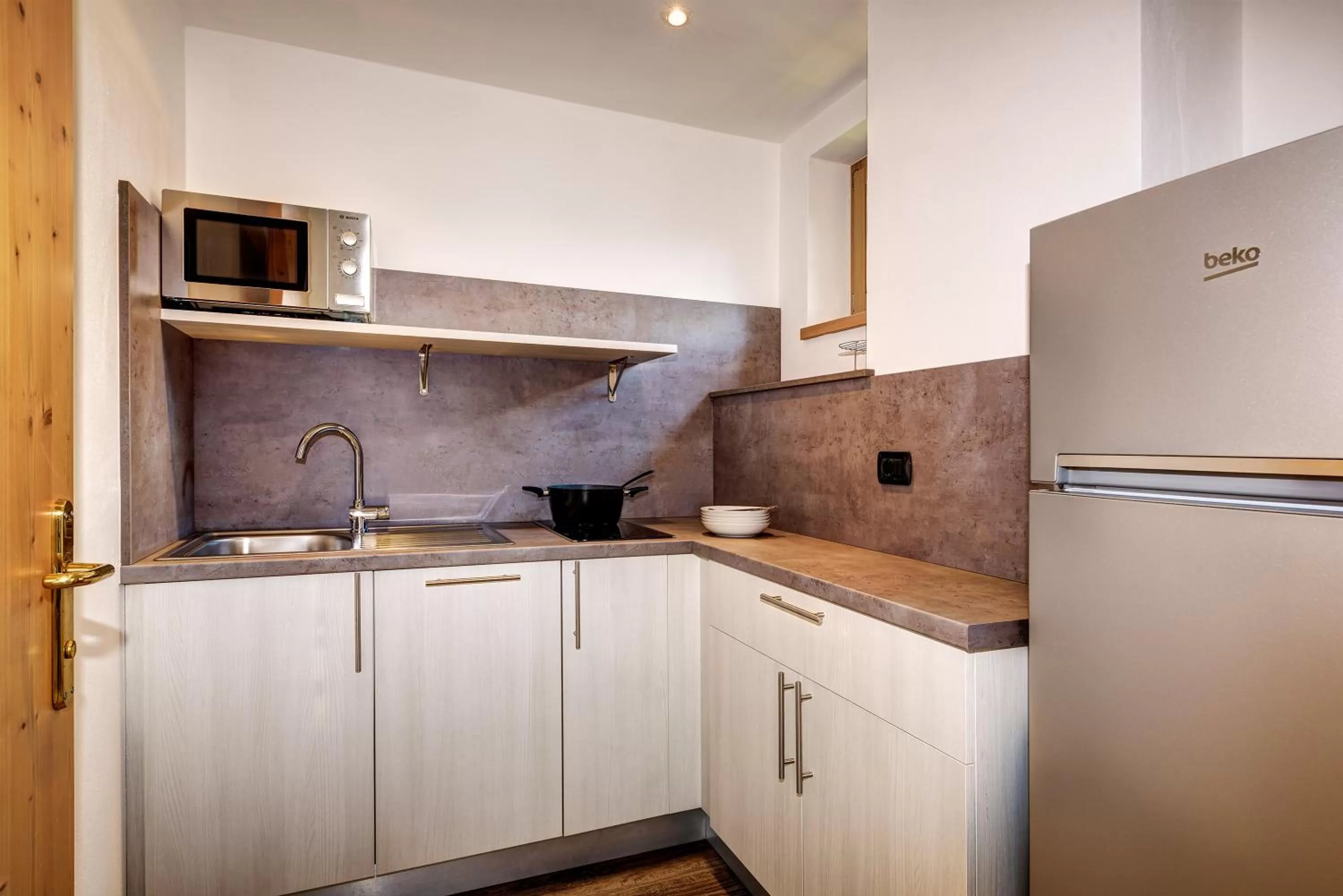 Kitchen or kitchenette in Aparthotel Wellness Villa di Bosco