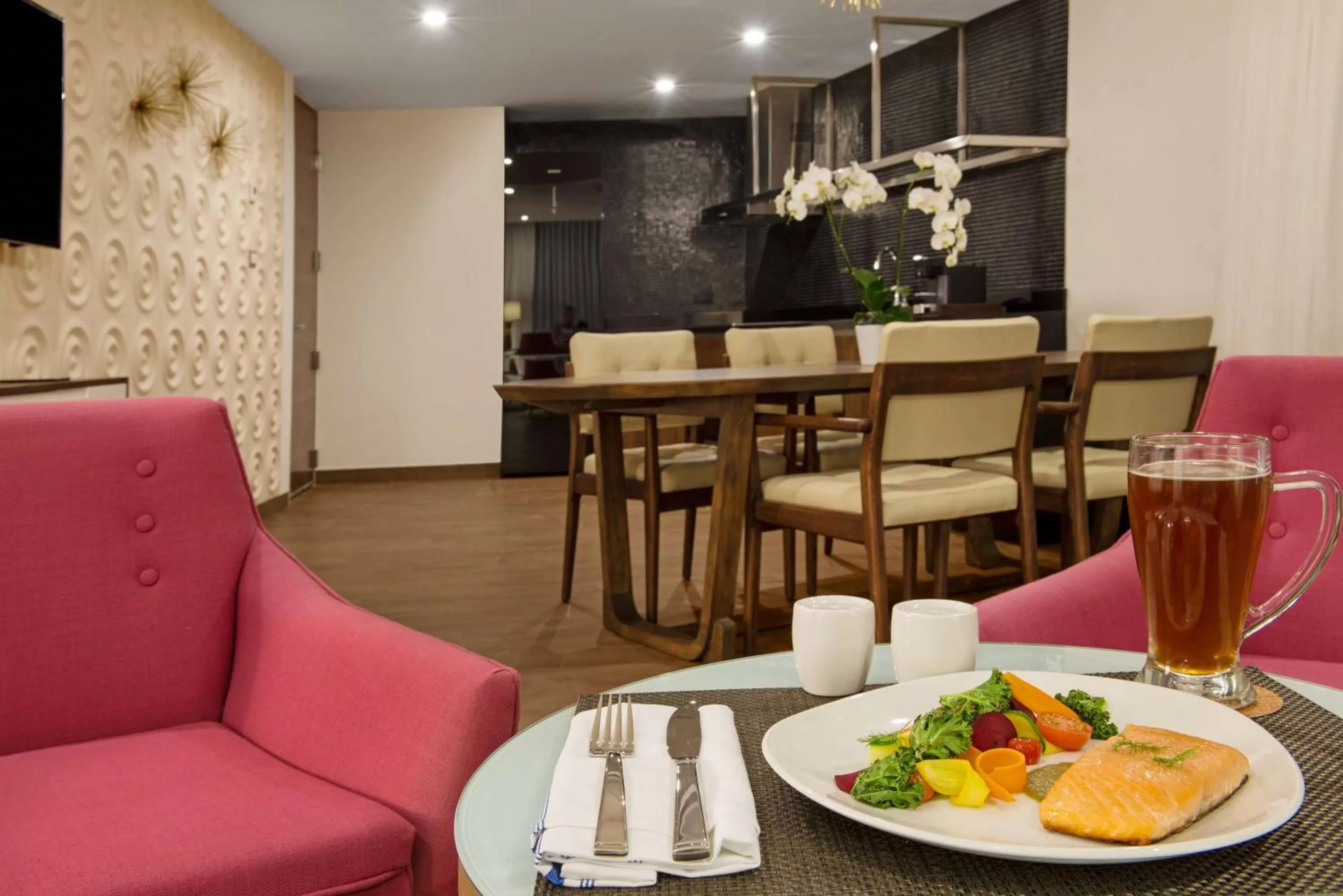 Living room in The Fives Downtown Hotel & Residences, Curio Collection by Hilton