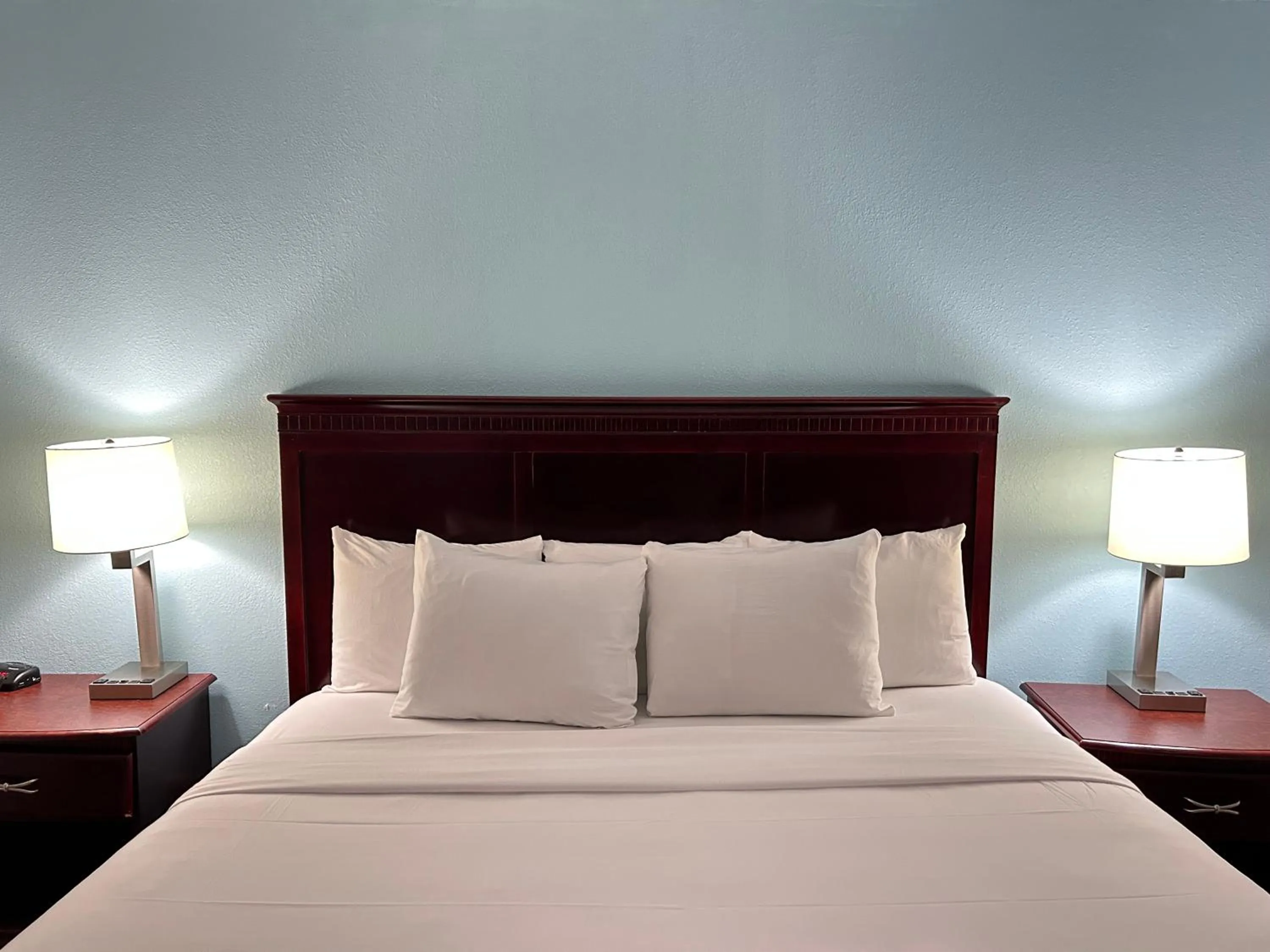 Bed in Clarion Inn & Suites Grand Rapids Airport