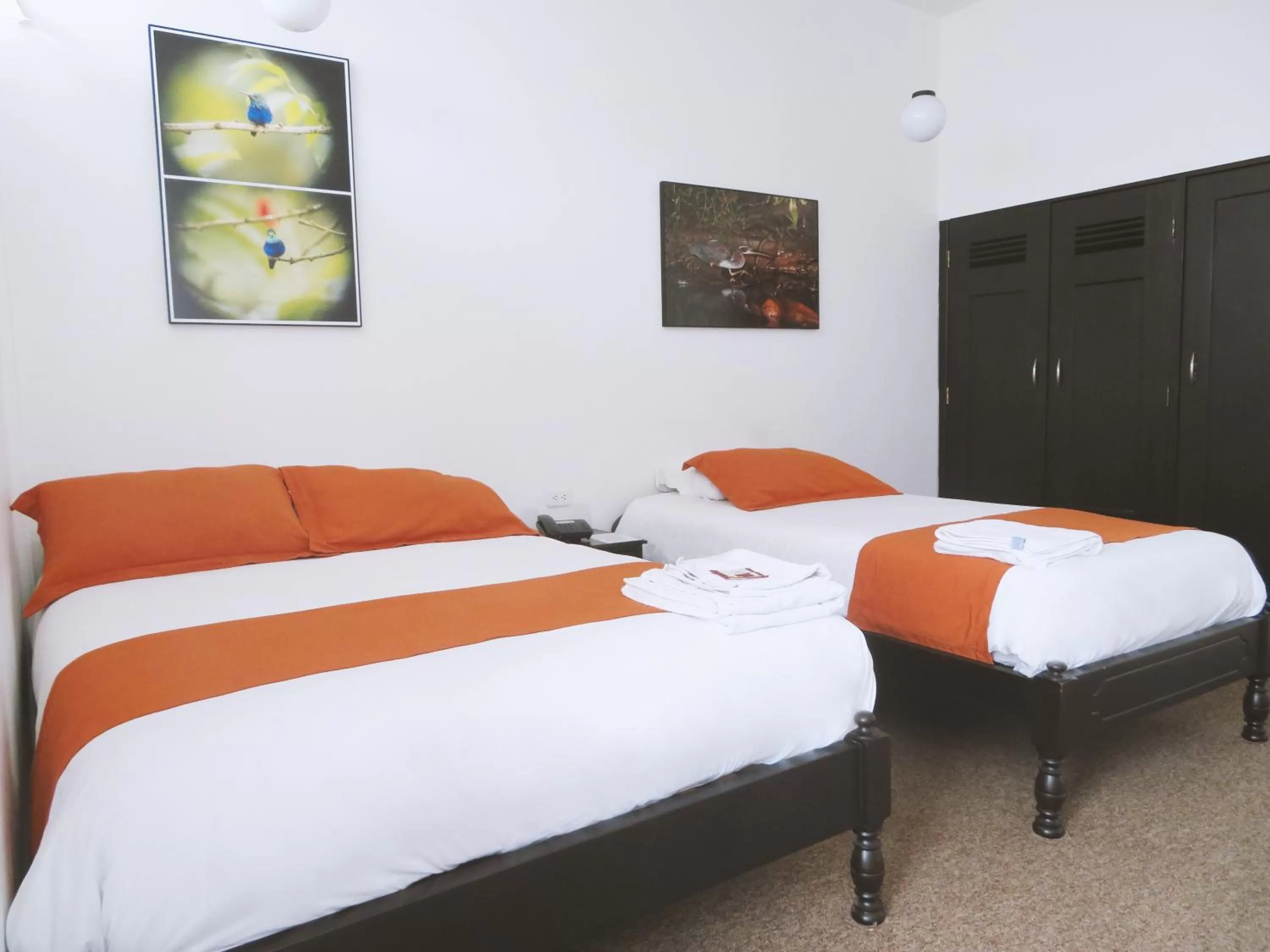 Bed in Bird Garden Guest House