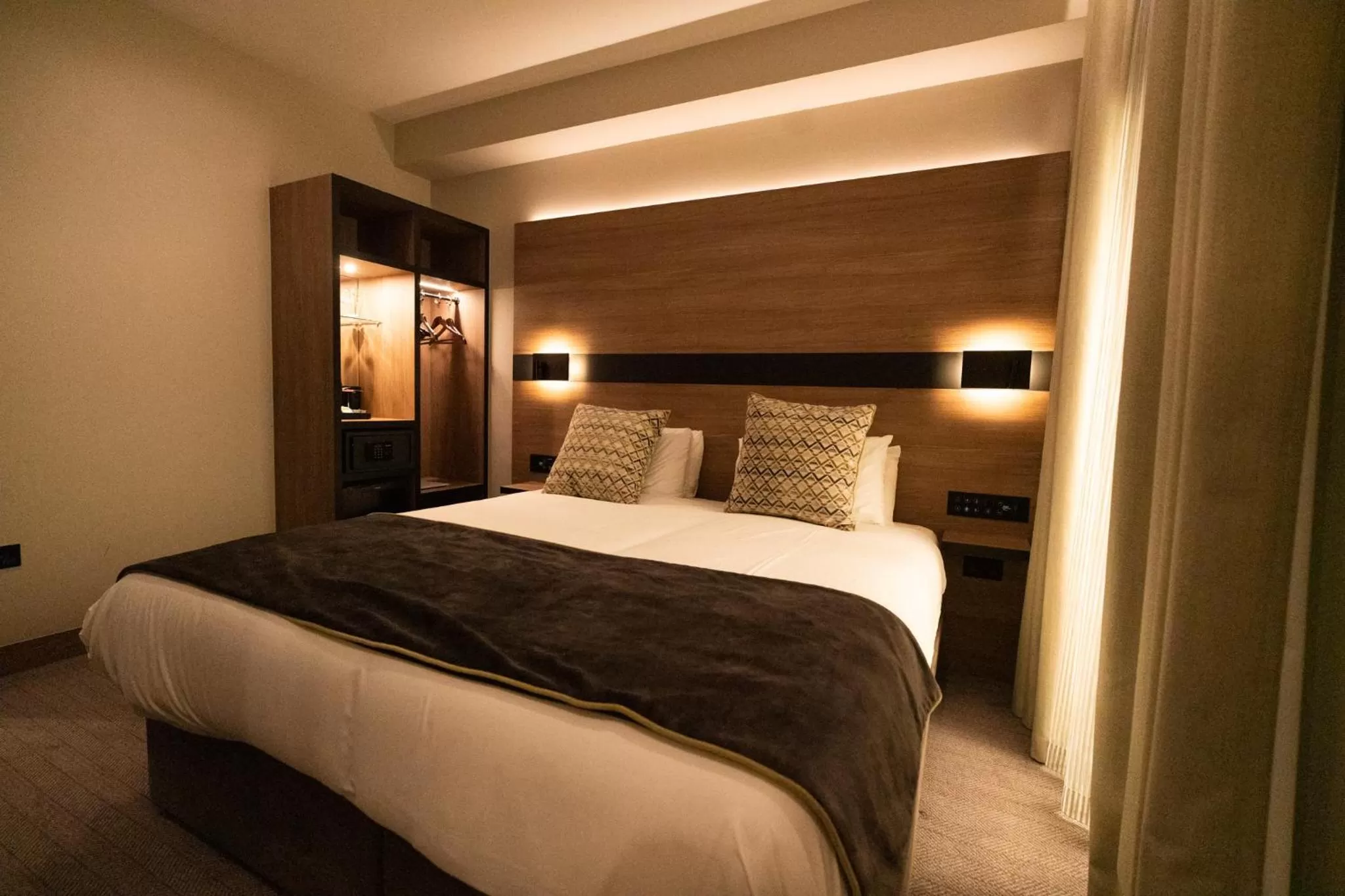 Bed in Merit Kensington Hotel