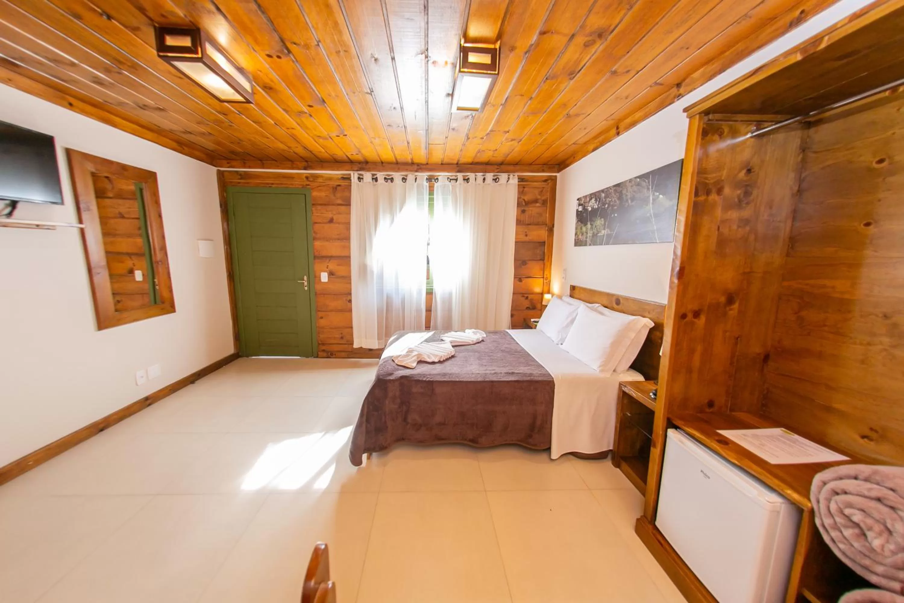 Bed in Pousada Charm Canela