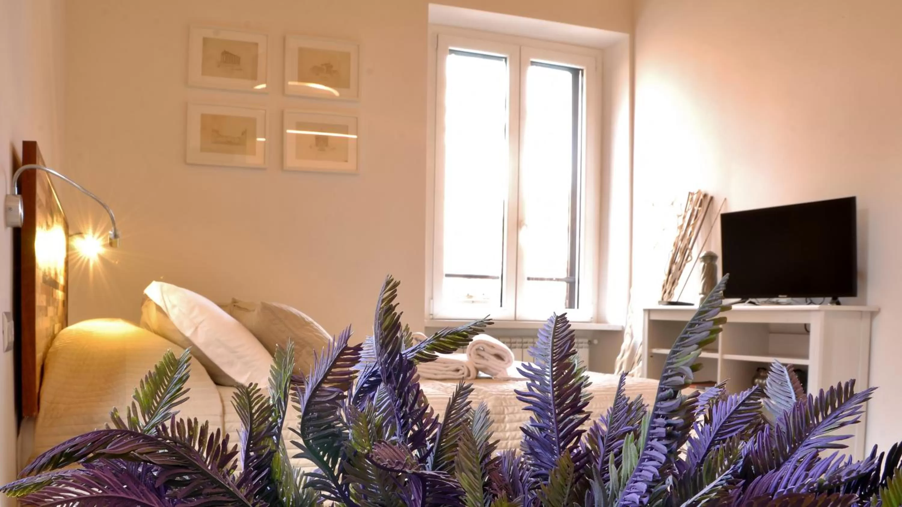 Communal lounge/ TV room in B&B Casa Angelini