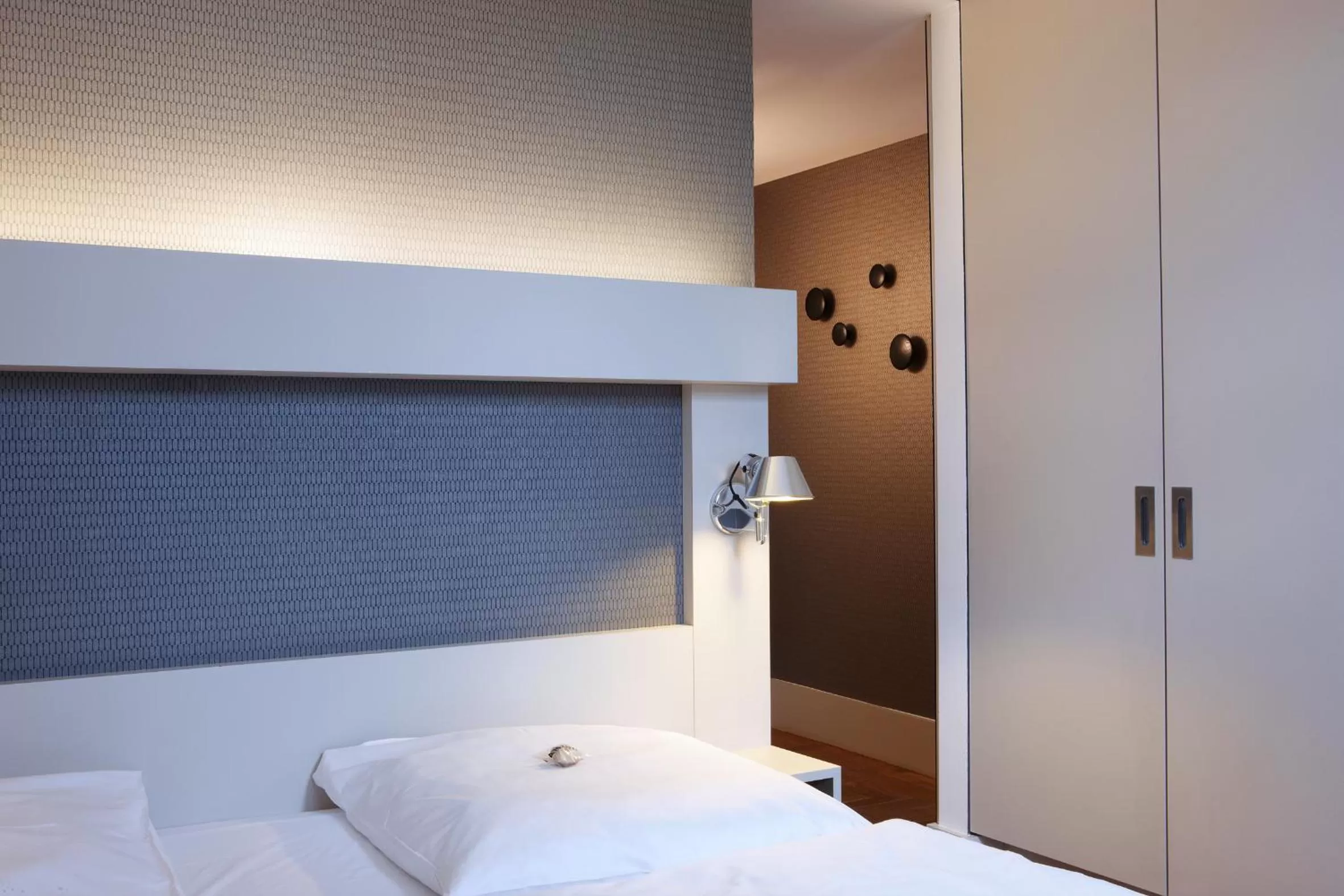 Bed in Hotel AMANO Rooms & Apartments