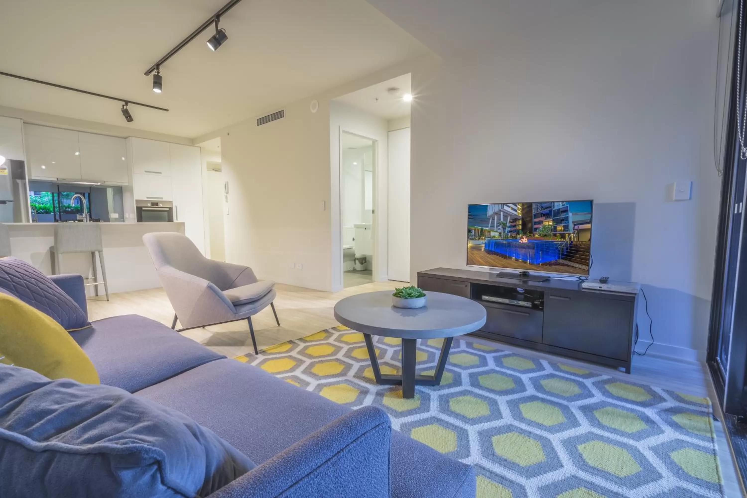 TV and multimedia in Arena Apartments by CLLIX