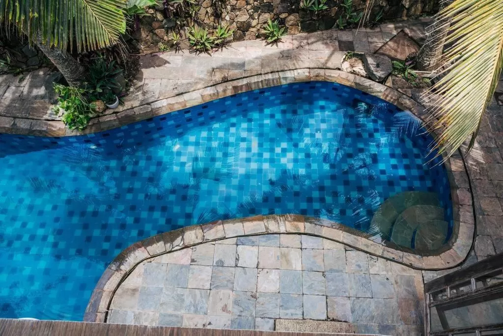 Swimming Pool in Sānti Beach House with pool & beach