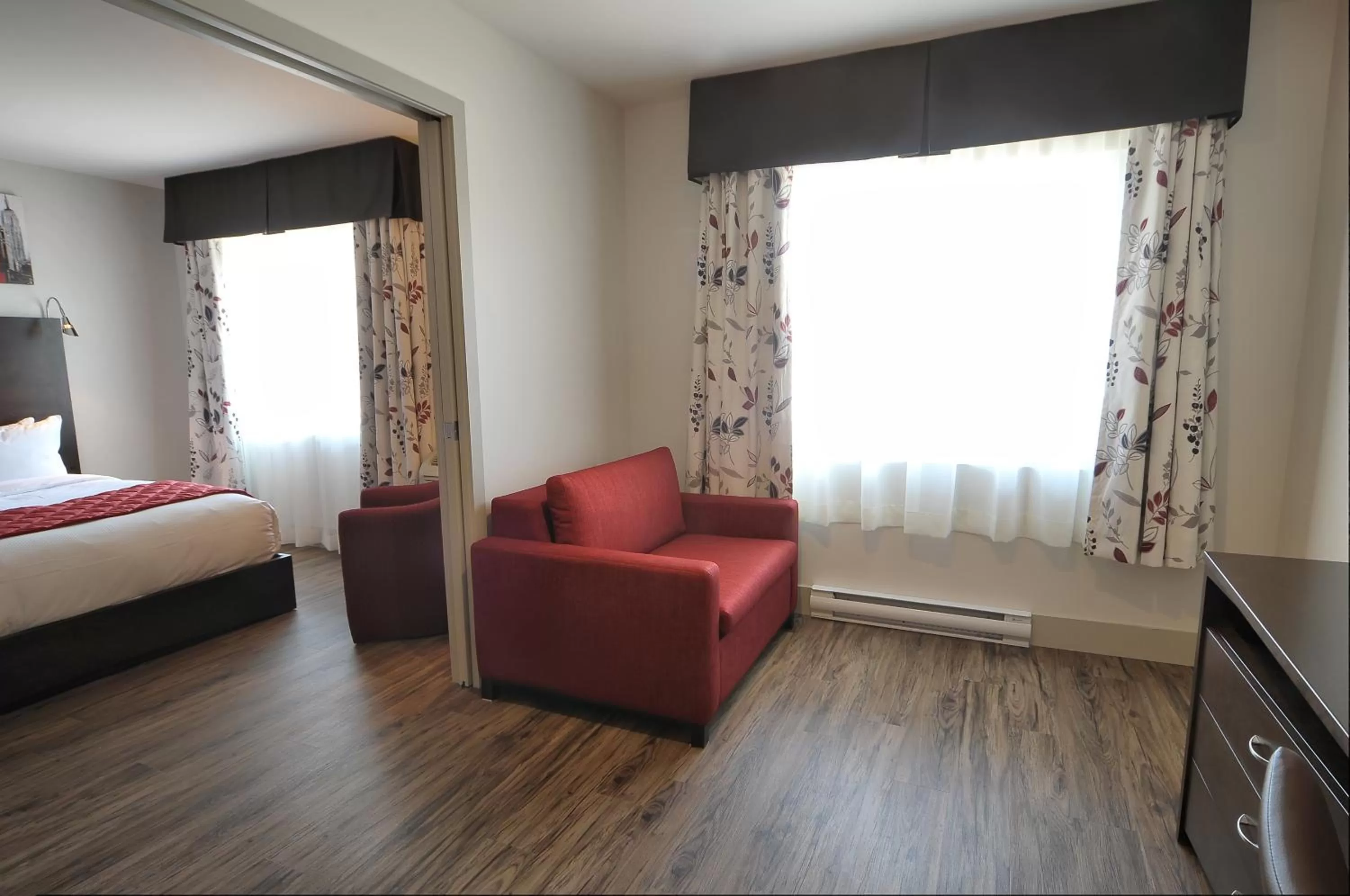 Living room, Bed in Hôtel Le Floral