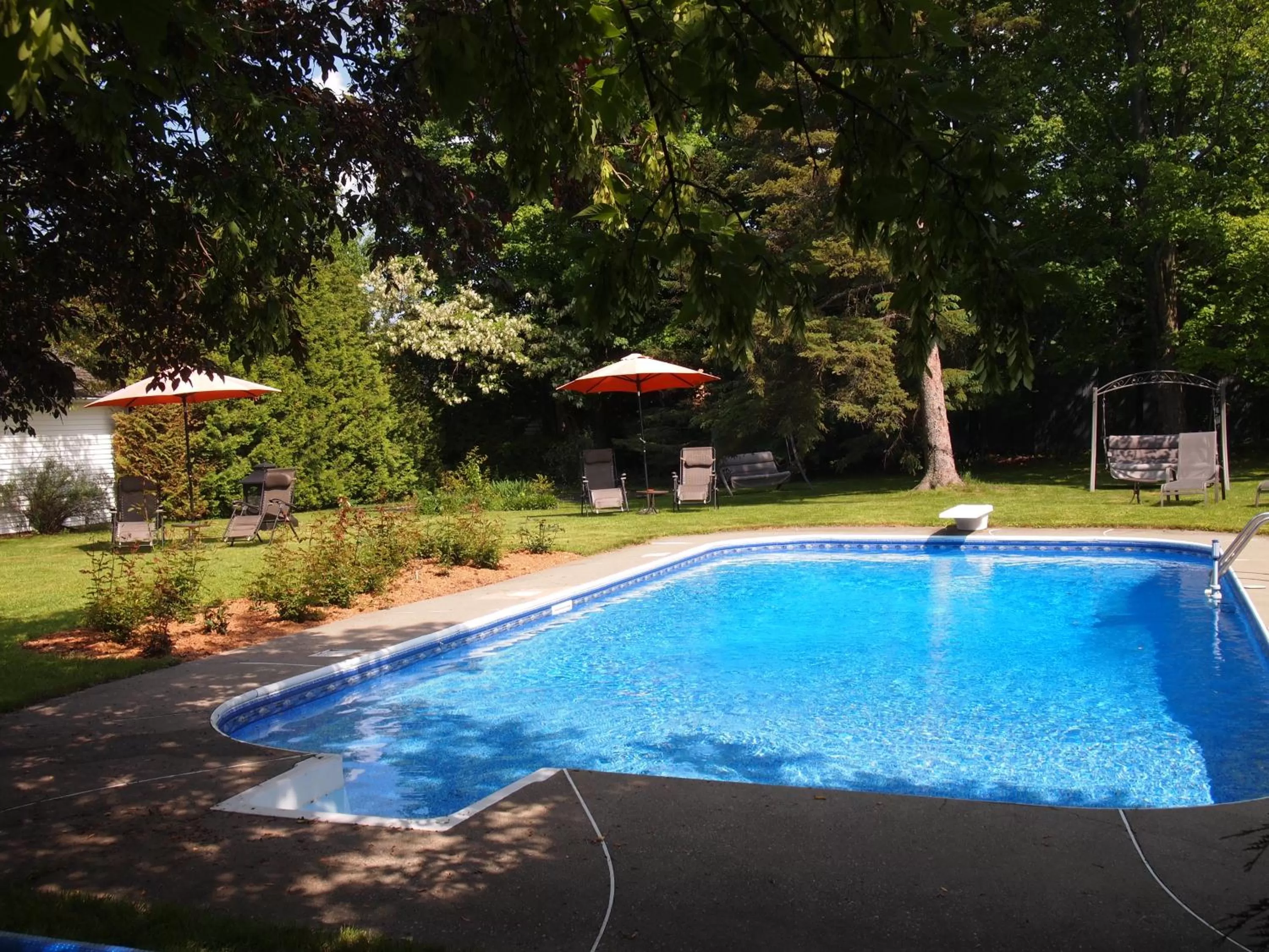 Swimming pool in Au Manoir de la rue Merry