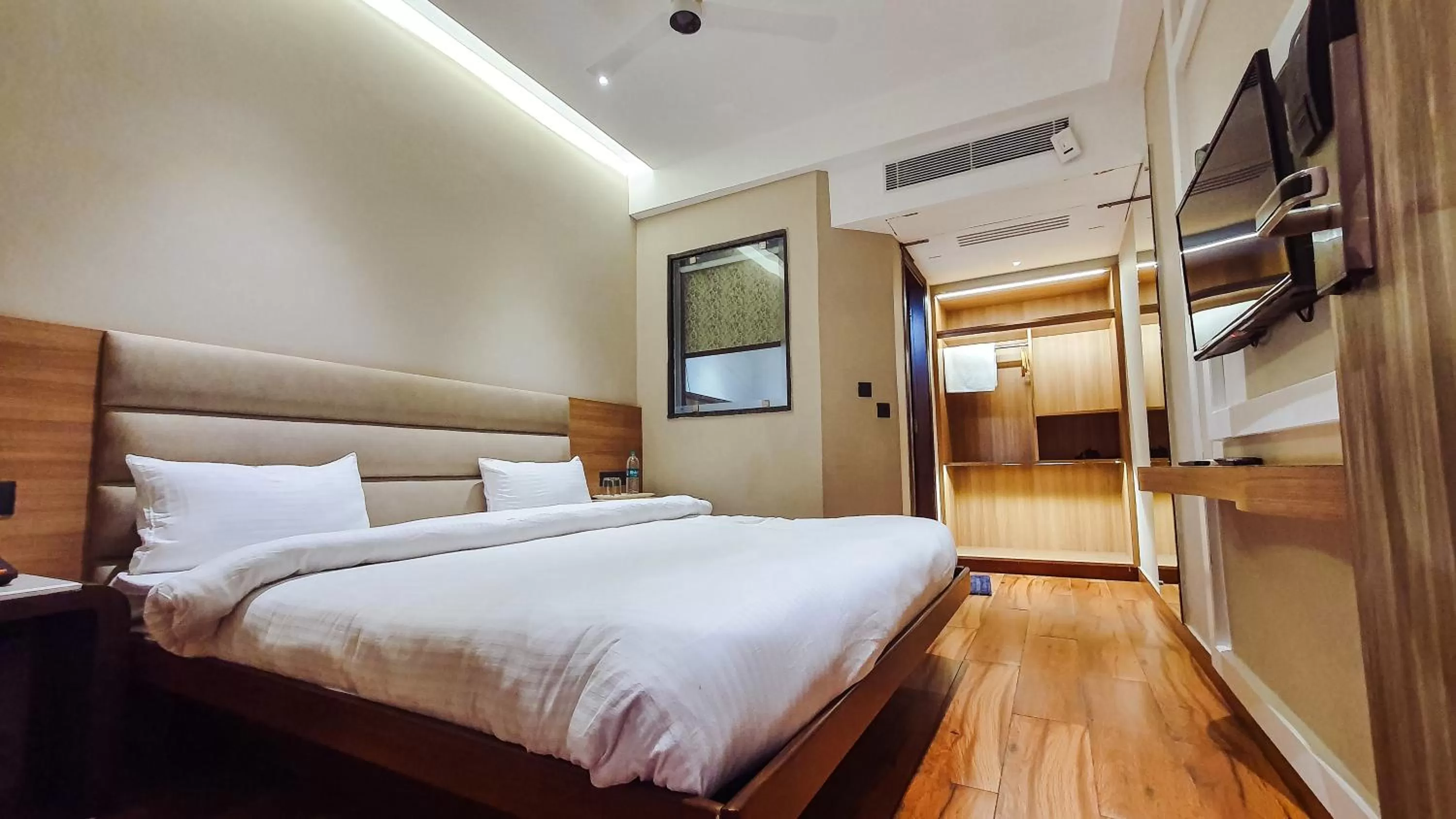 Bed in Aura Rooms