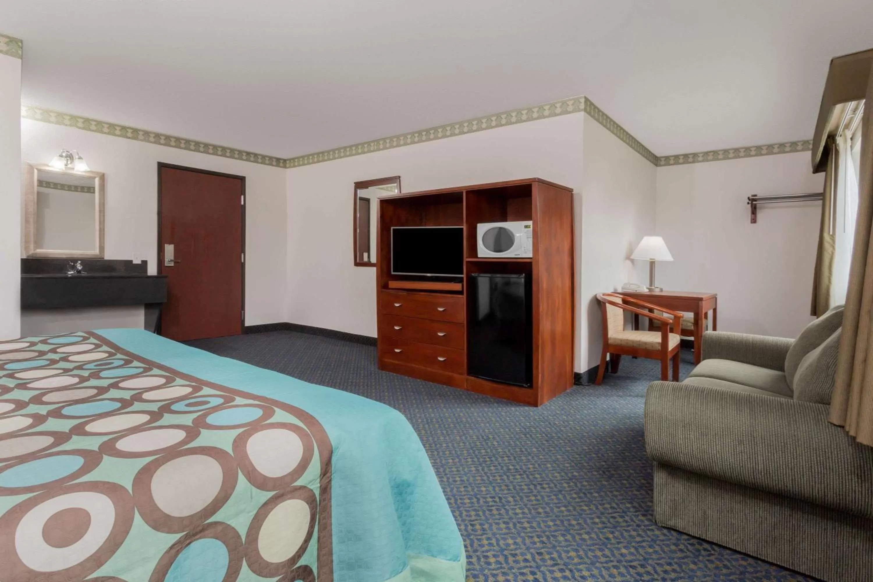 Photo of the whole room, TV/Entertainment Center in Super 8 by Wyndham Sacramento