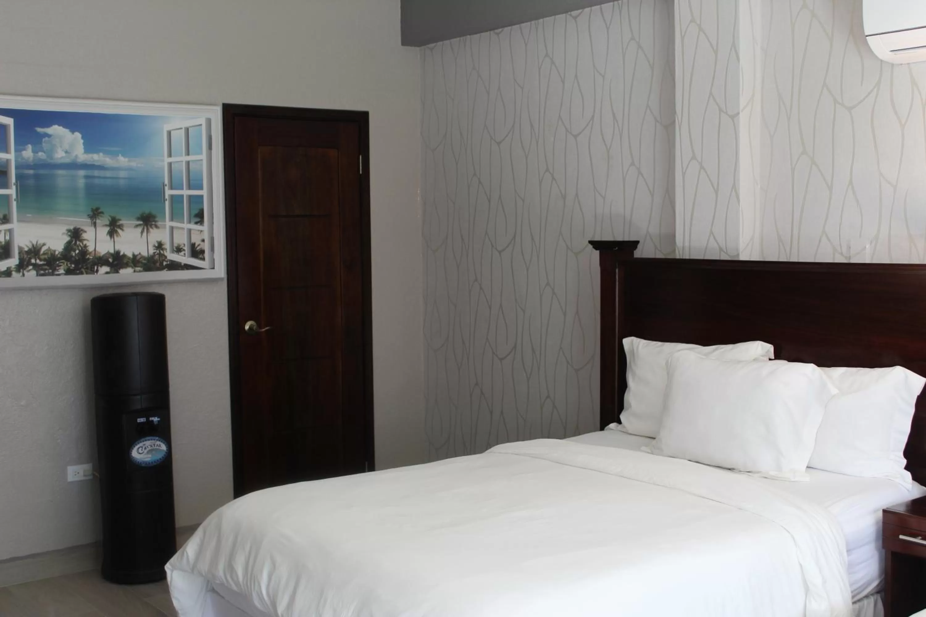 View (from property/room), Bed in Barefoot Caye Caulker Hotel