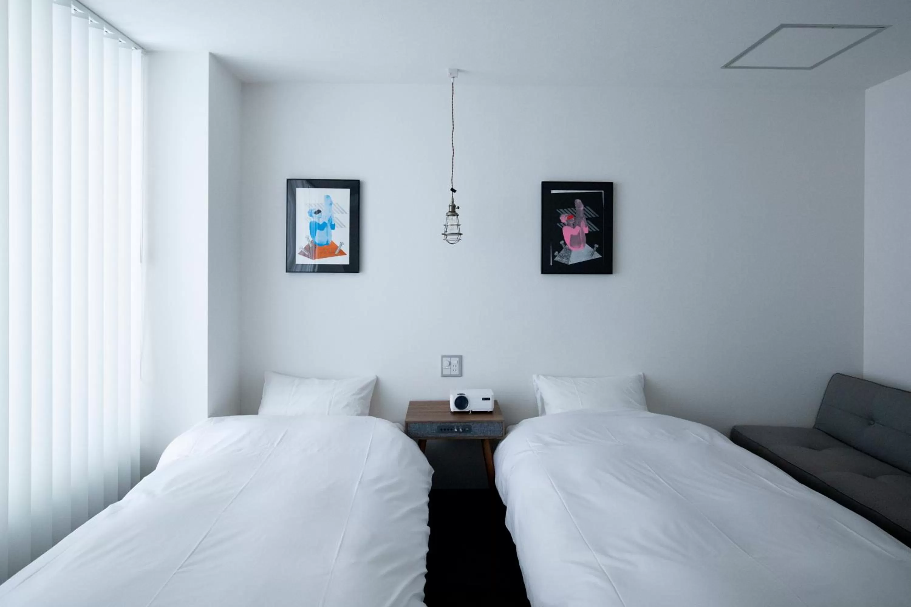 Bed in BENJAMIN HOTEL KANAZAWA