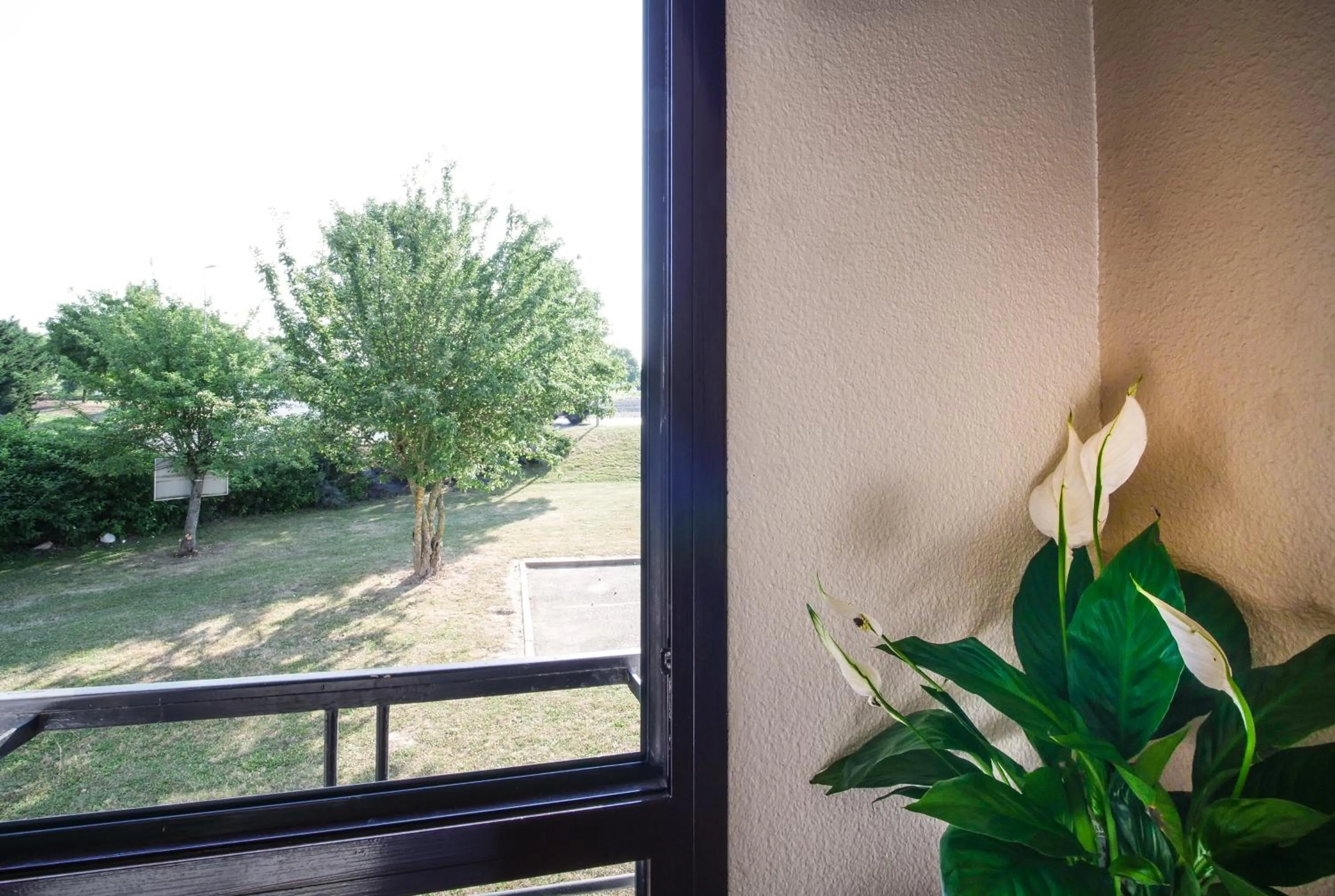 Garden view in Hôtel Inn Design Resto Novo Chartres