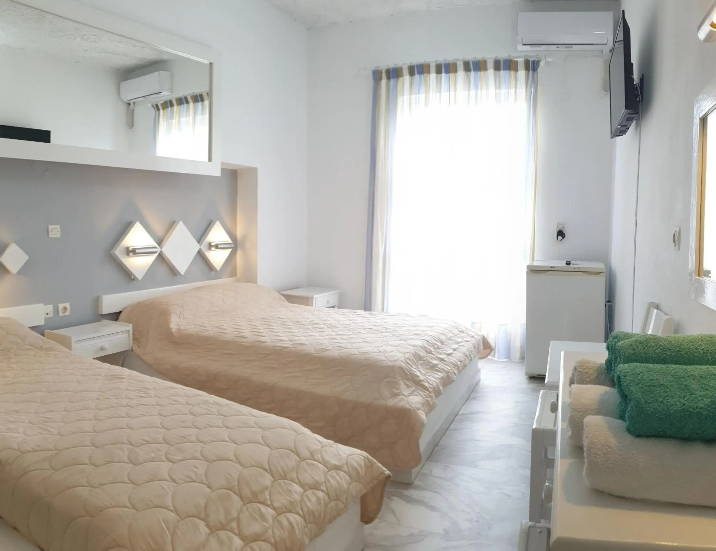 Triple Room in Porto Castello Triple Room in Porto Castello