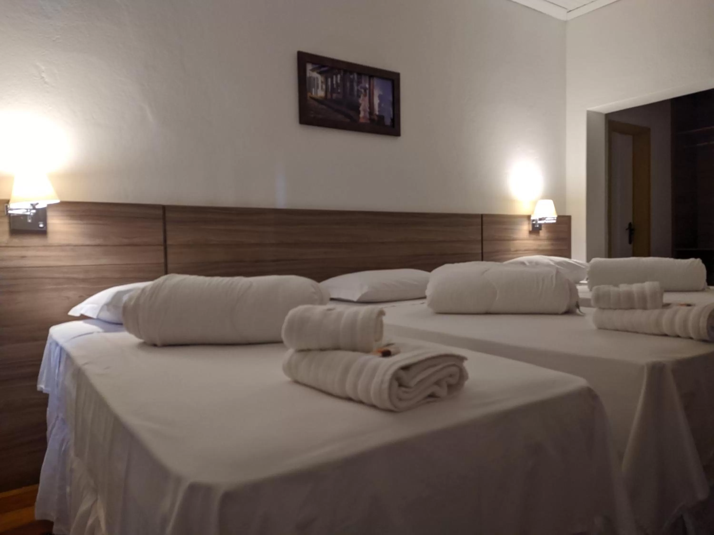 Bed in Pousada o Amanhecer