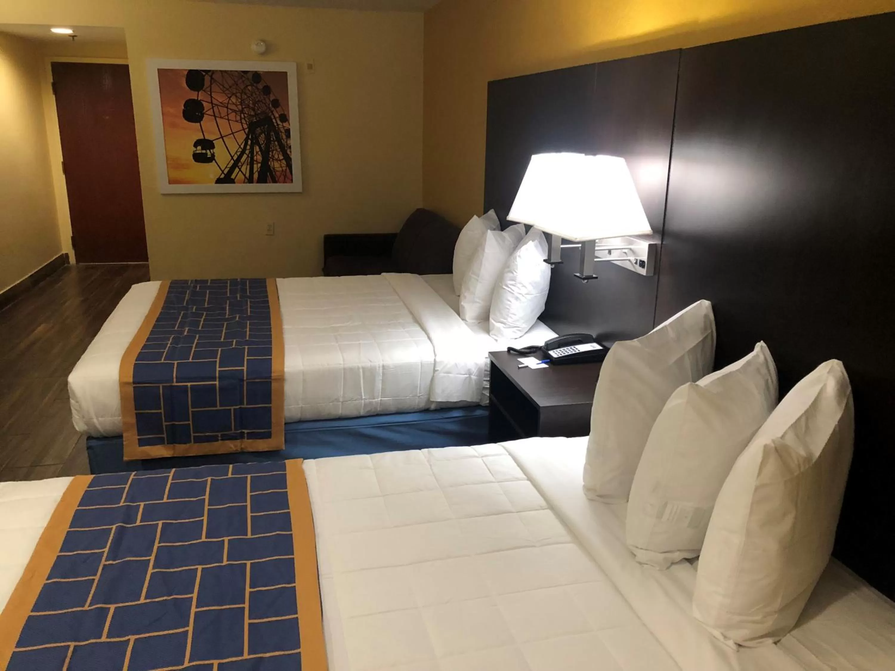 Queen Room with Two Queen Beds and Mobility/Hearing Access - Non-Smoking in Days Inn & Suites by Wyndham Tampa/Raymond James Stadium