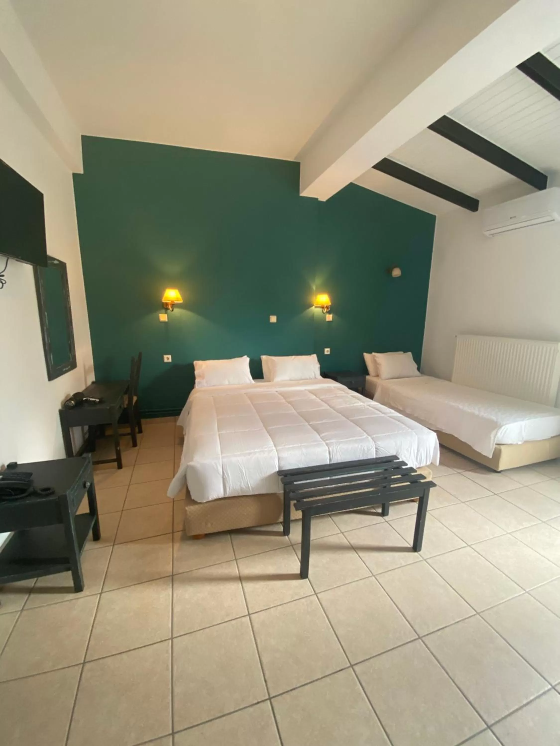 Bed in Ikaros Art Hotel