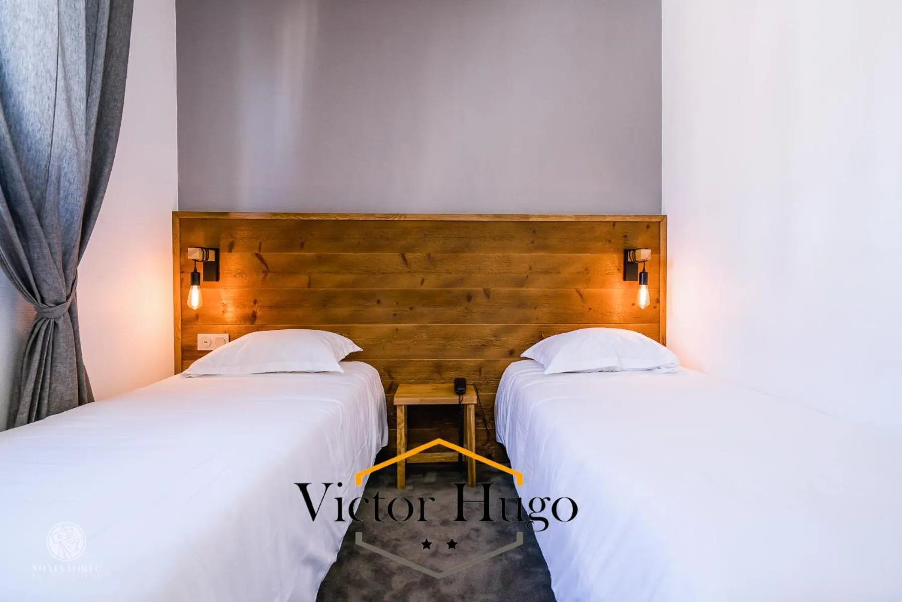 Bed in Hôtel Victor Hugo Lorient