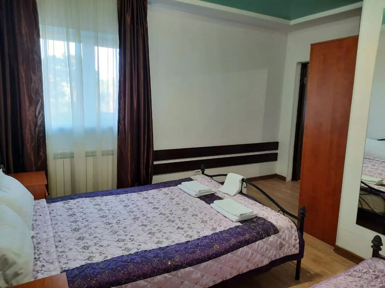 Bed in Zhaylau Hotel