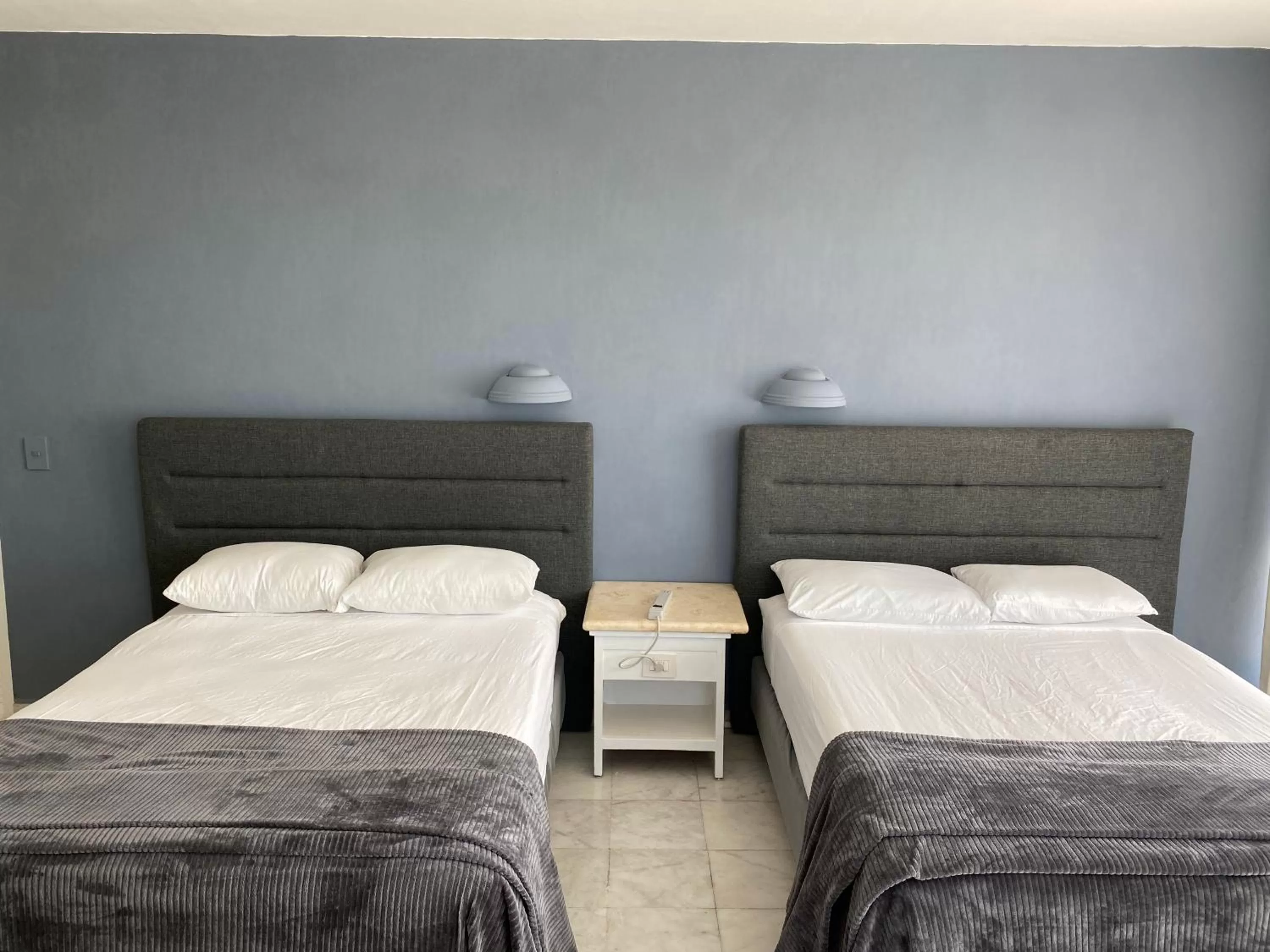 Bedroom, Bed in Condos inside an Ocean Front Hotel Resort