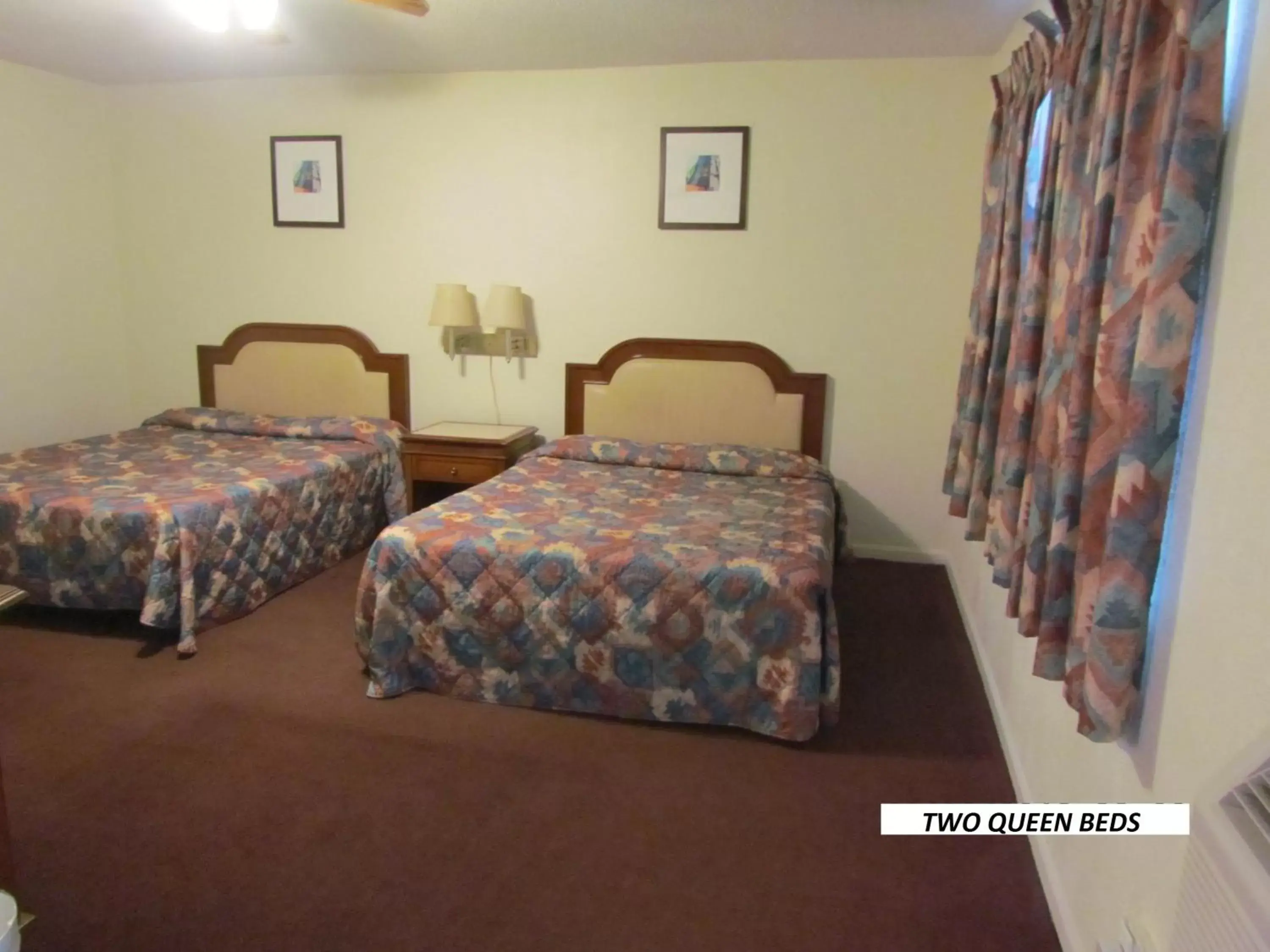Queen Room with Two Queen Beds - single occupancy - Smoking in Economy Inn Queen Room with Two Queen Beds - single occupancy - Smoking in Economy Inn