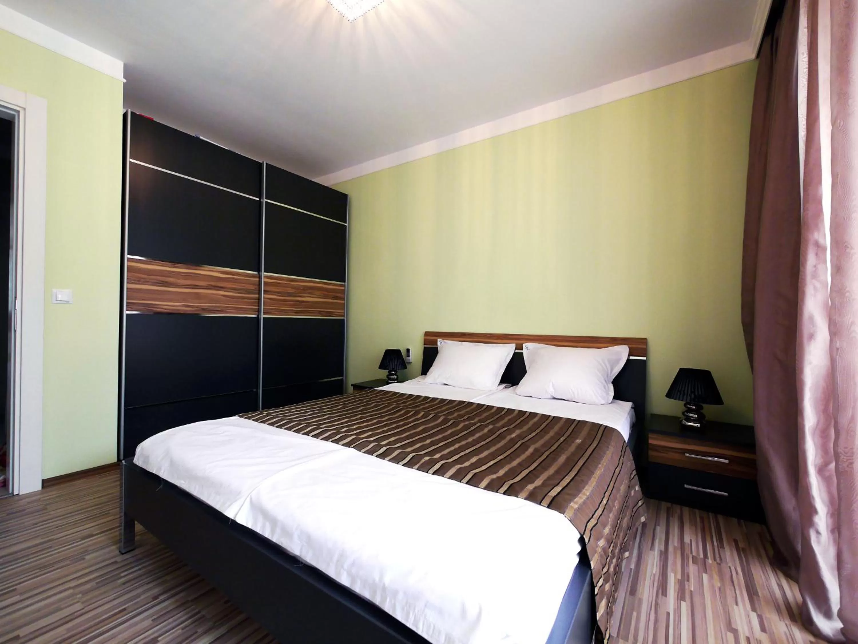 Bed in APART-HOTEL Stamopolu Lux с изглед към морето