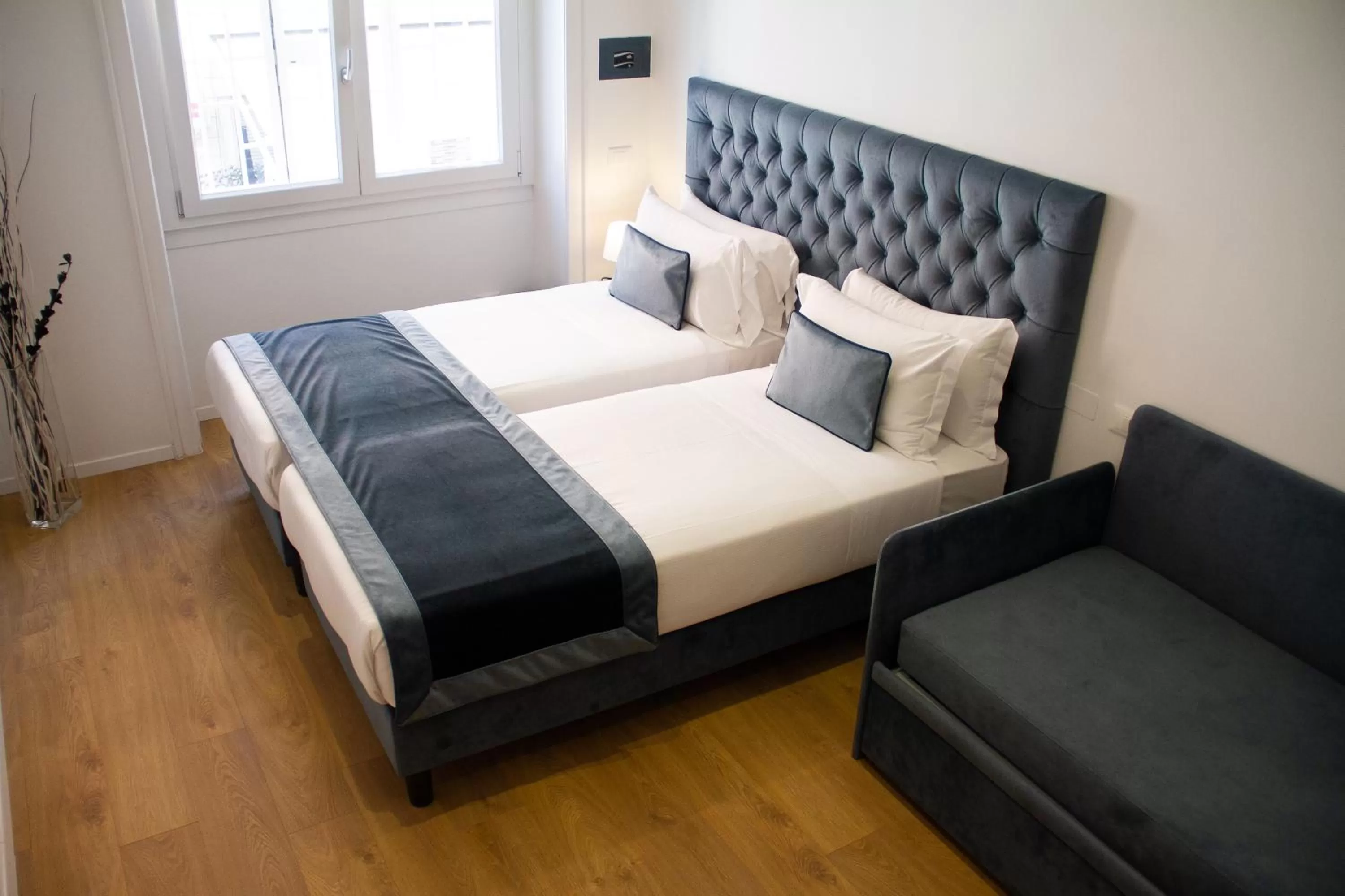 Bed in Michelangelo Vatican Rooms