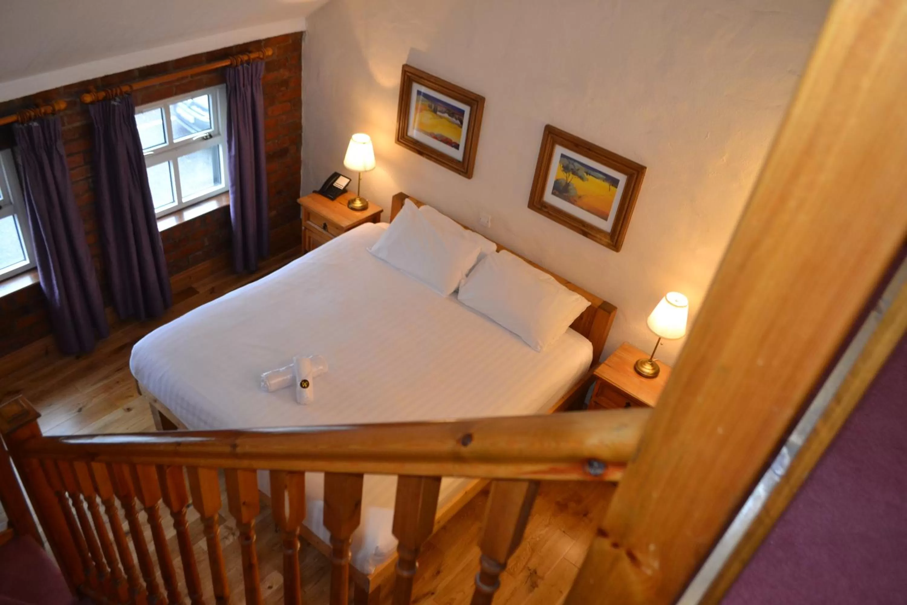 Bed in Walsh's Hotel and Apartments