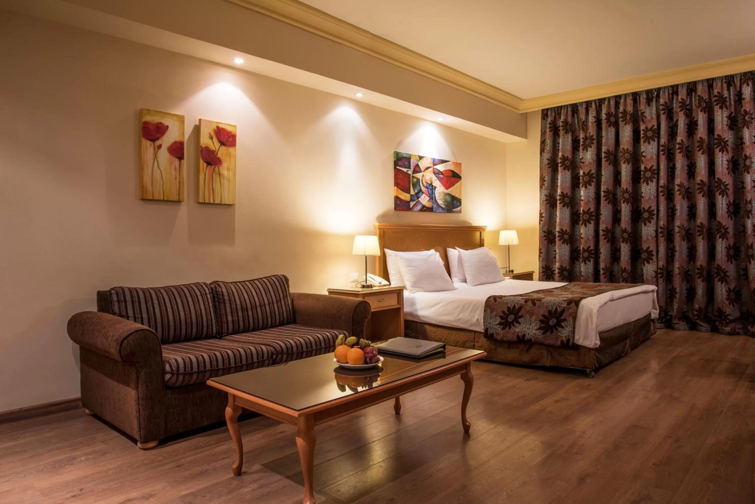 Bed, Seating Area in Bella Riva Hotel