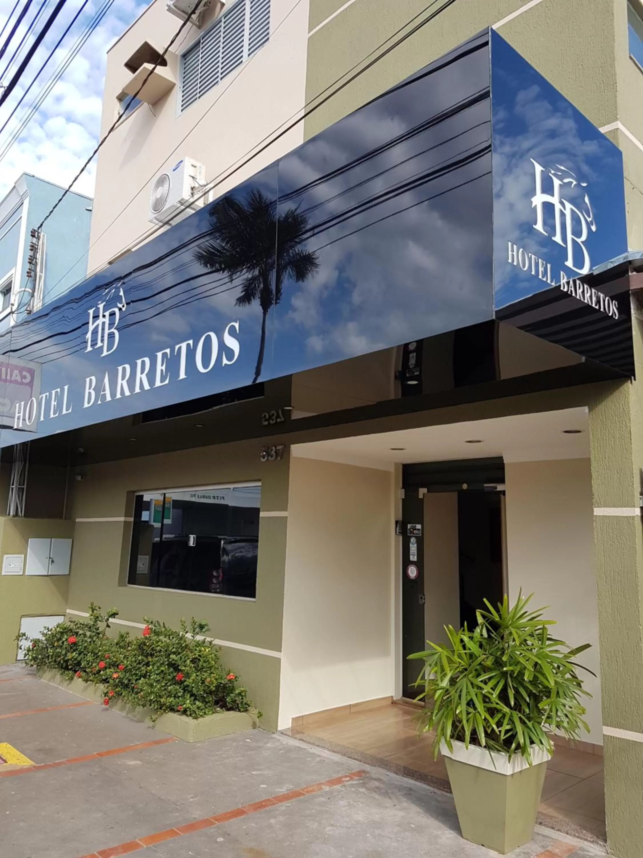 Property building, Property Logo/Sign in Hotel Barretos