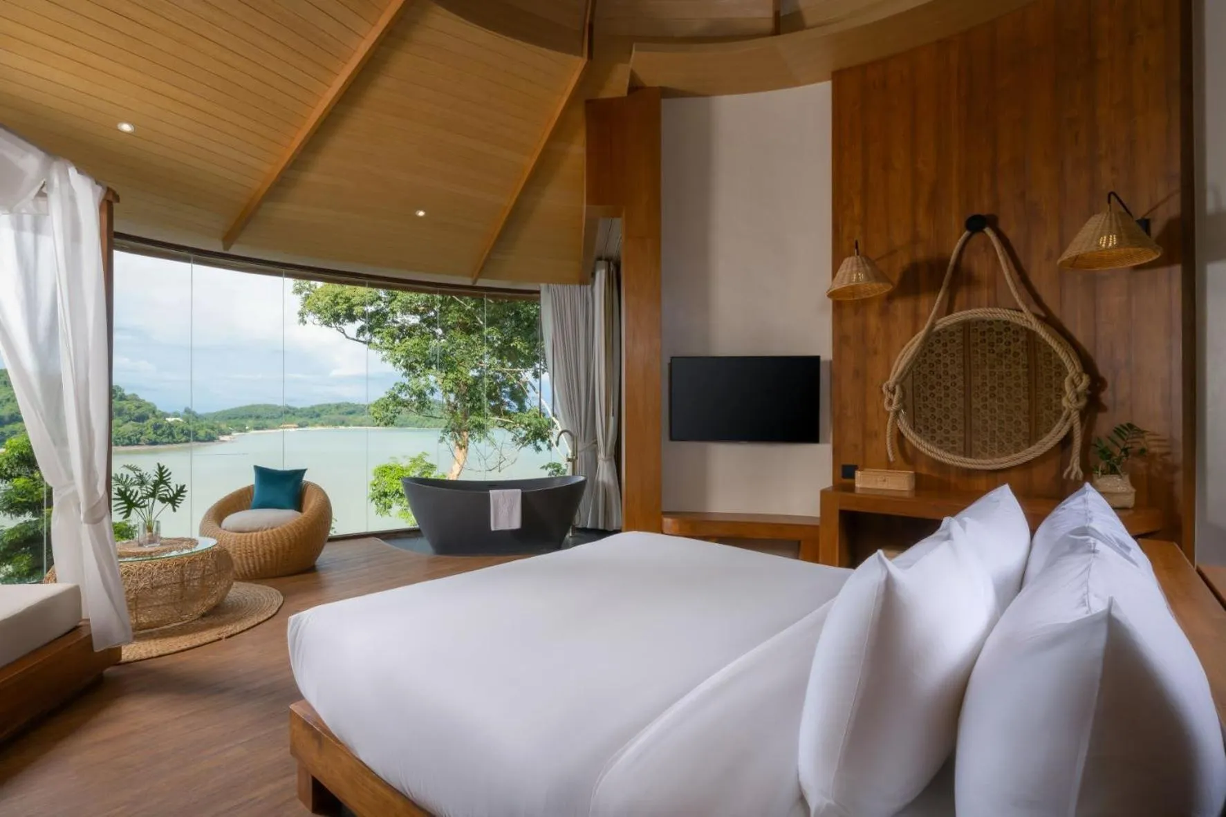 Bed in SINAE Phuket Luxury Hotel