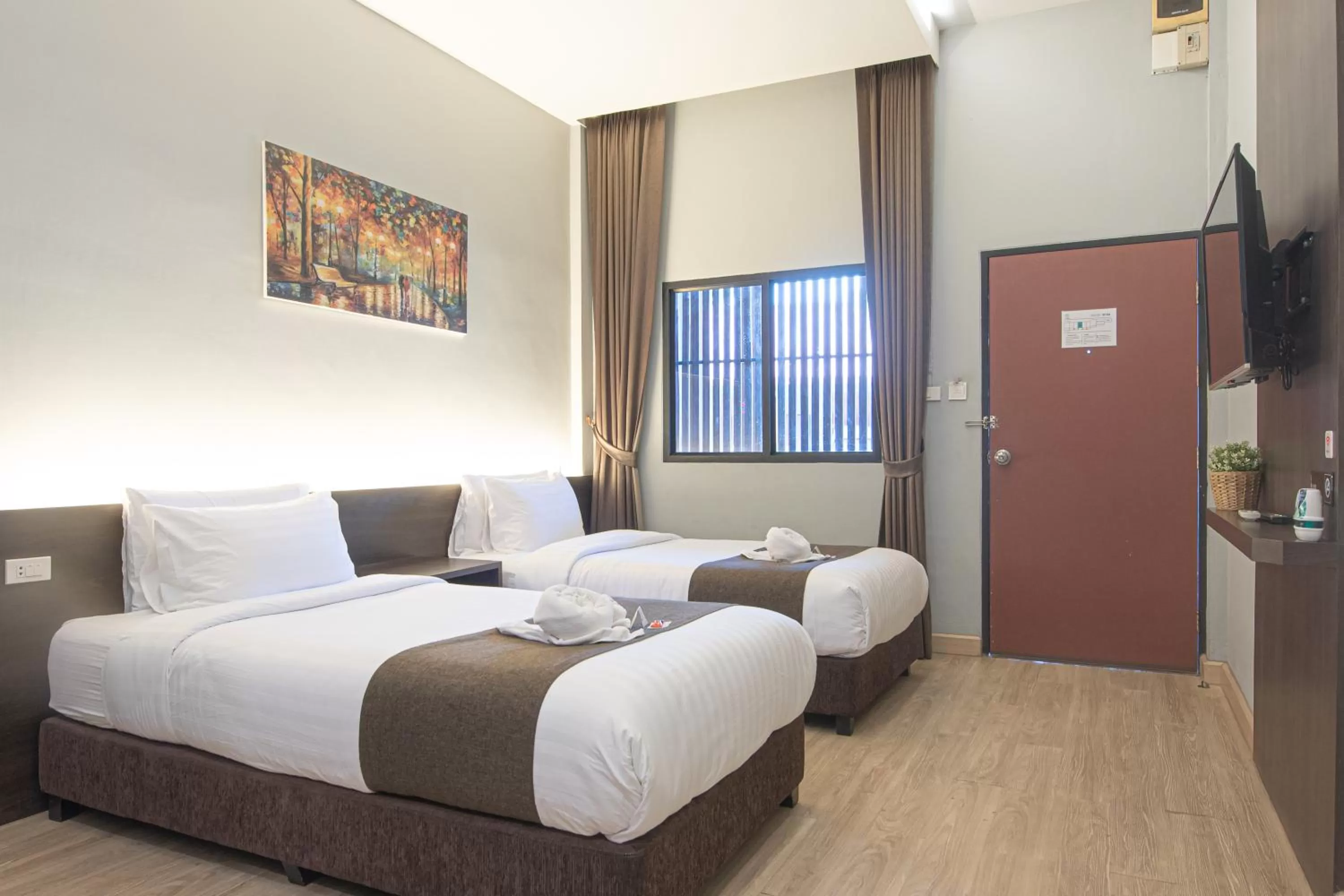 Bed in Tarnsiri Boutique Resort