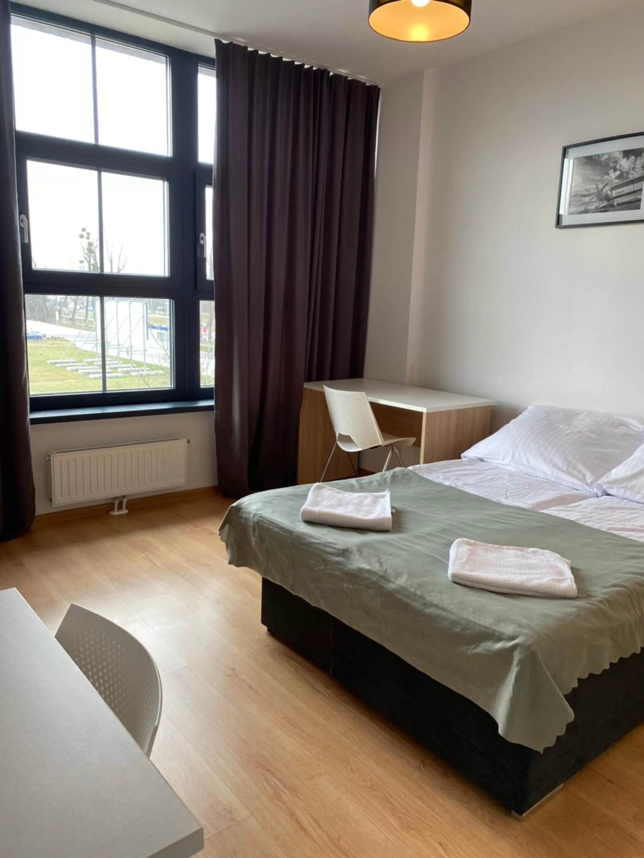 Bed in SleepWell Apartments