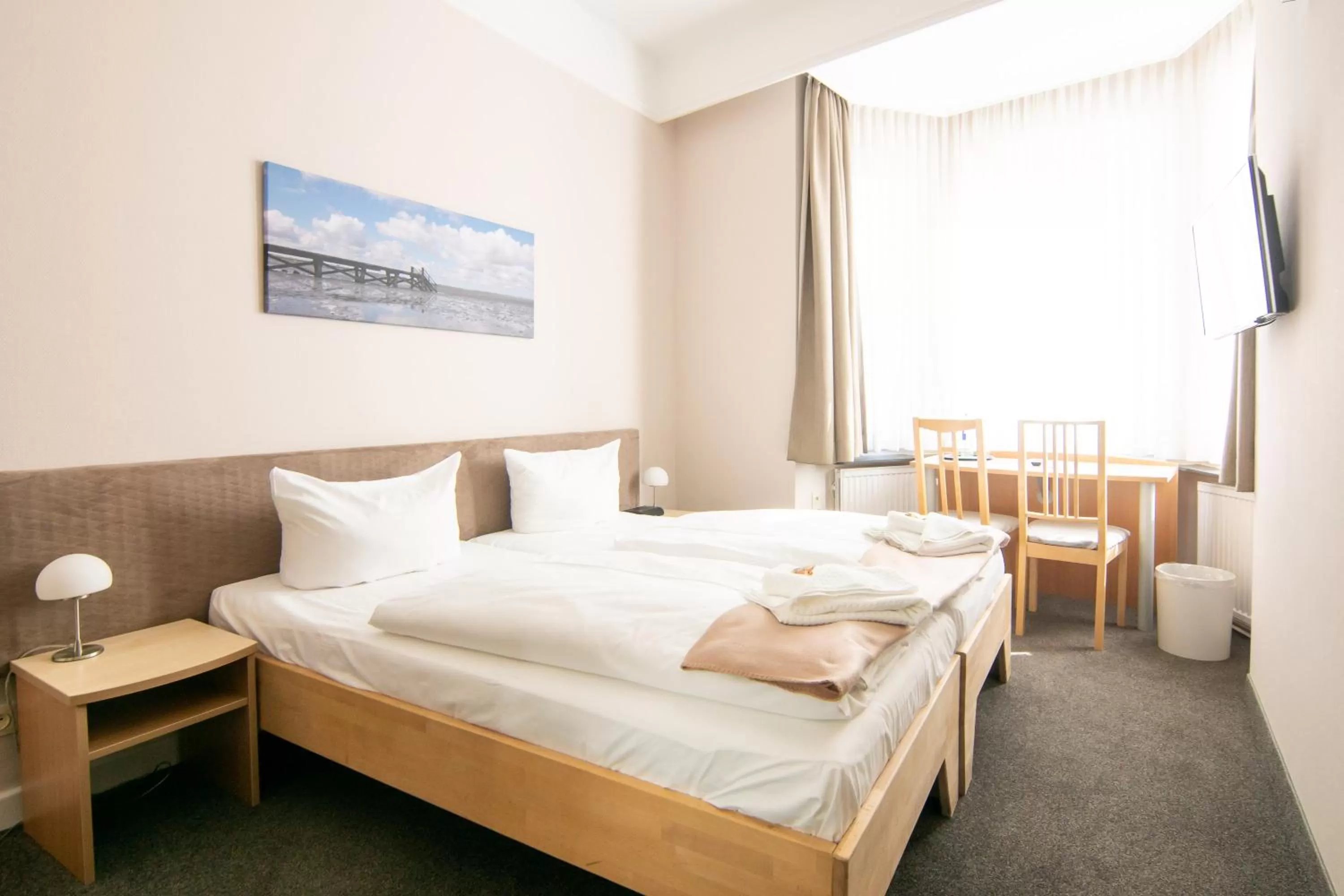 Photo of the whole room, Bed in Nordsee-Hotel Hinrichsen