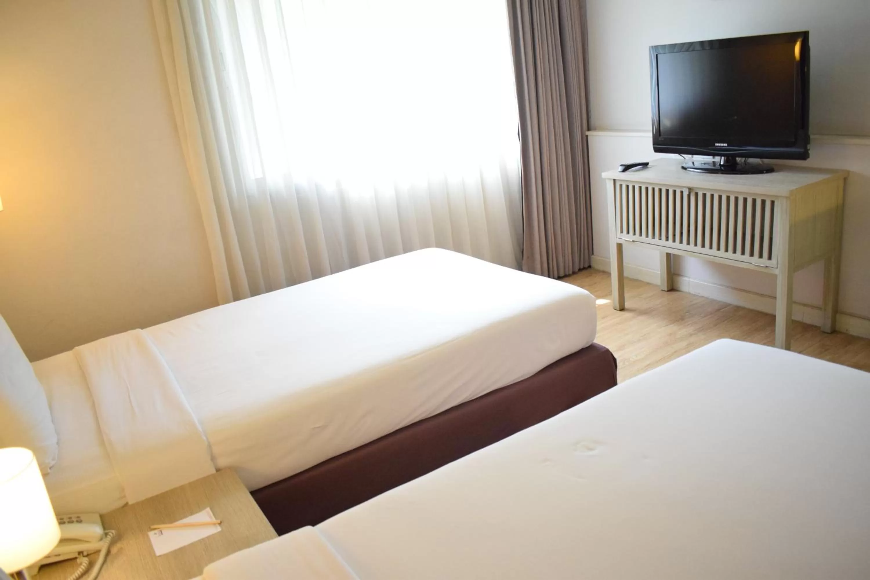 Bed in Trang Hotel Bangkok - SHA Plus