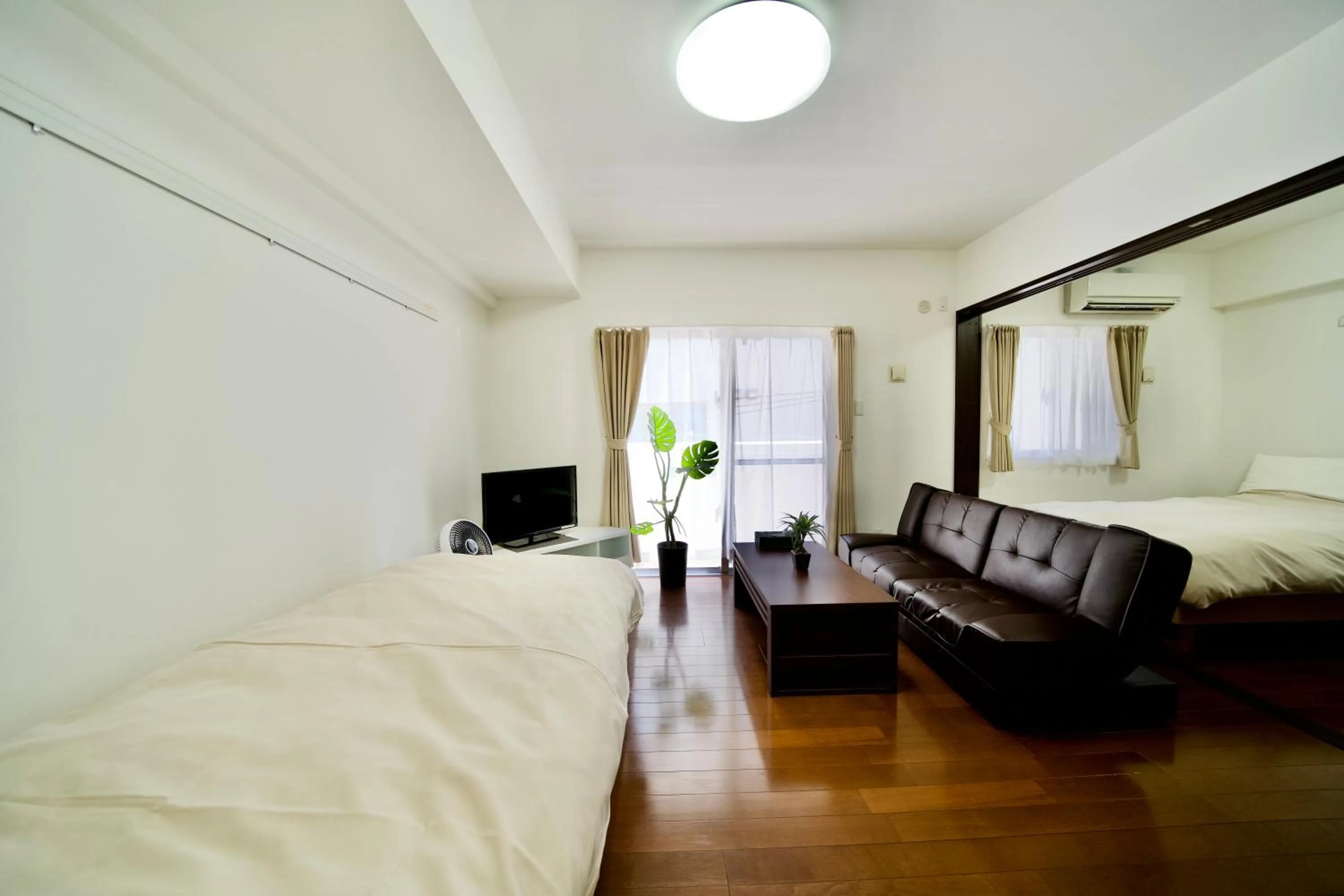 Seating area, Bed in Villa Izumizaki