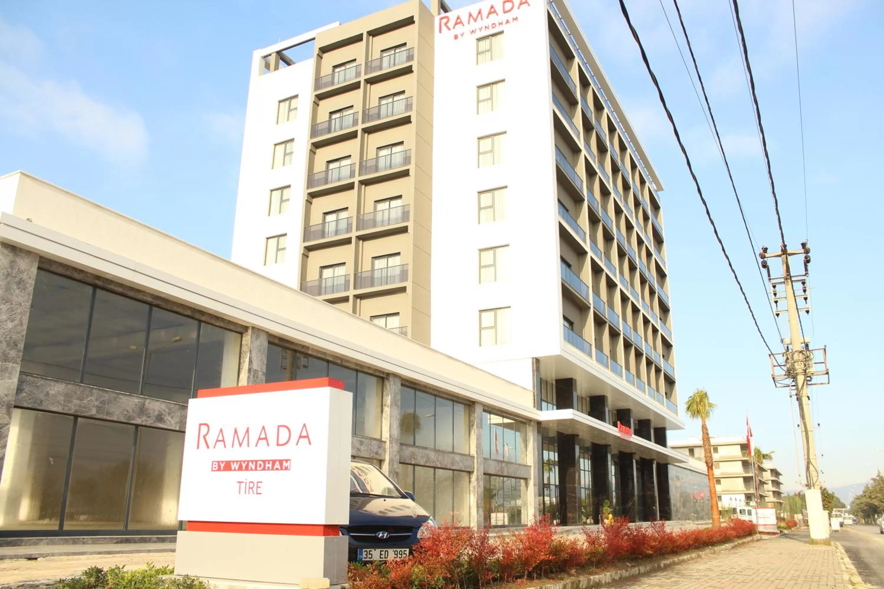 Property logo or sign in Ramada By Wyndham Tire