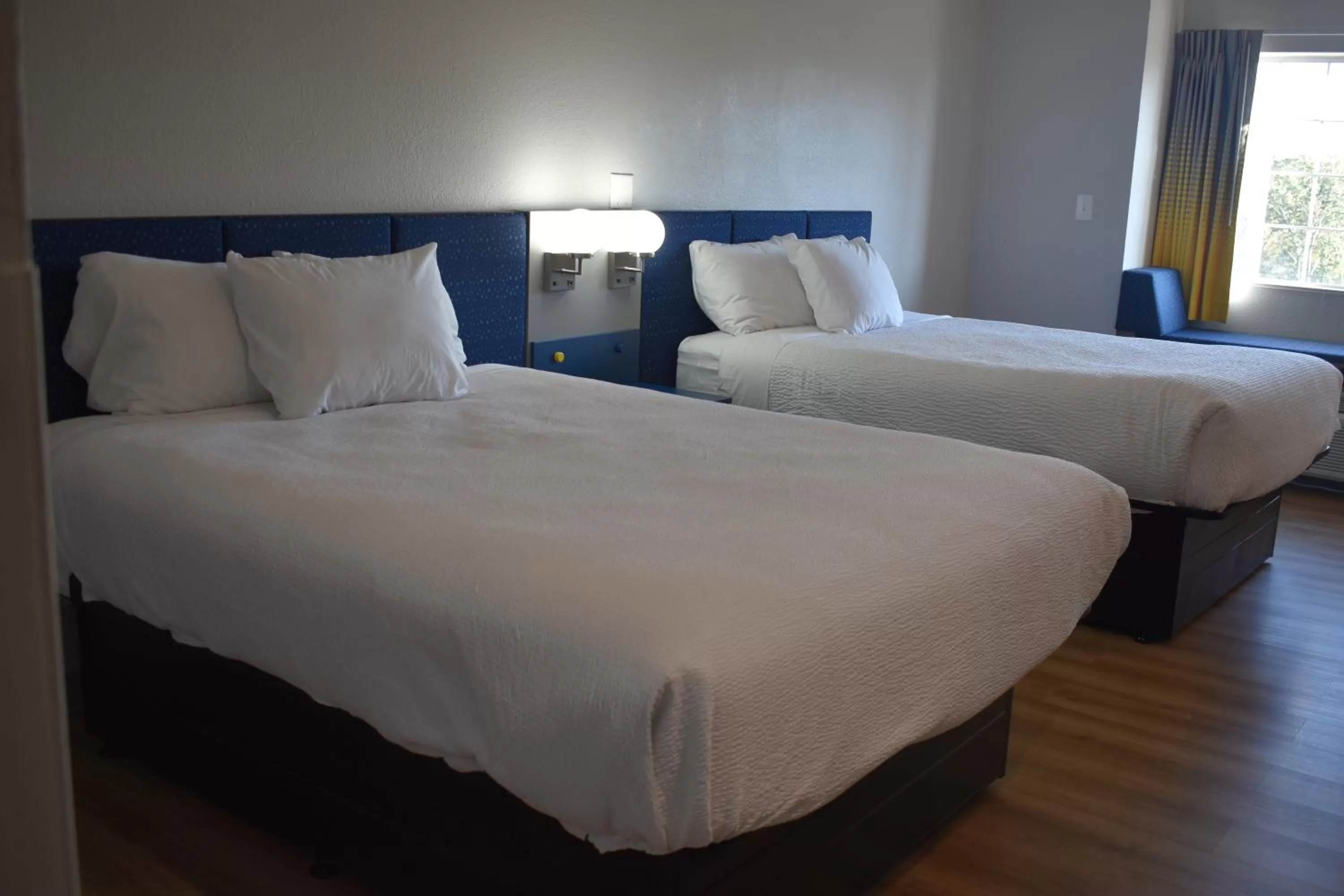Bed in Microtel Inn & Suites by Wyndham Stockbridge/Atlanta I-75