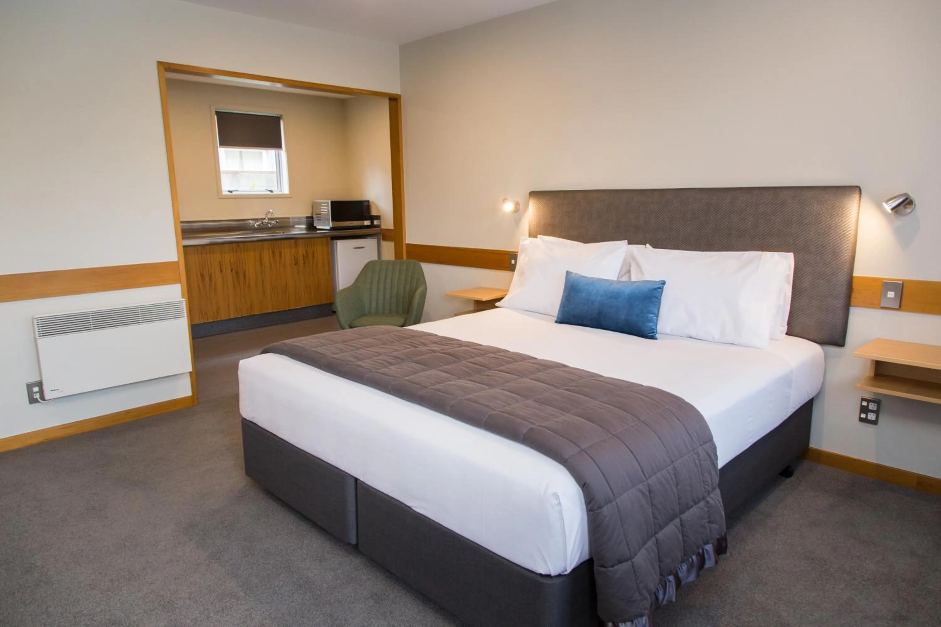 Bed in Dunedin Motel and Villas