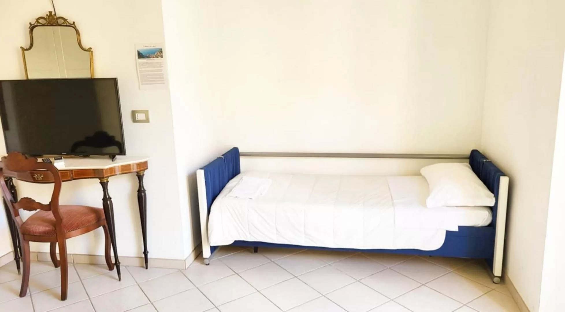 Bed in Santi e Saraceni Rooms