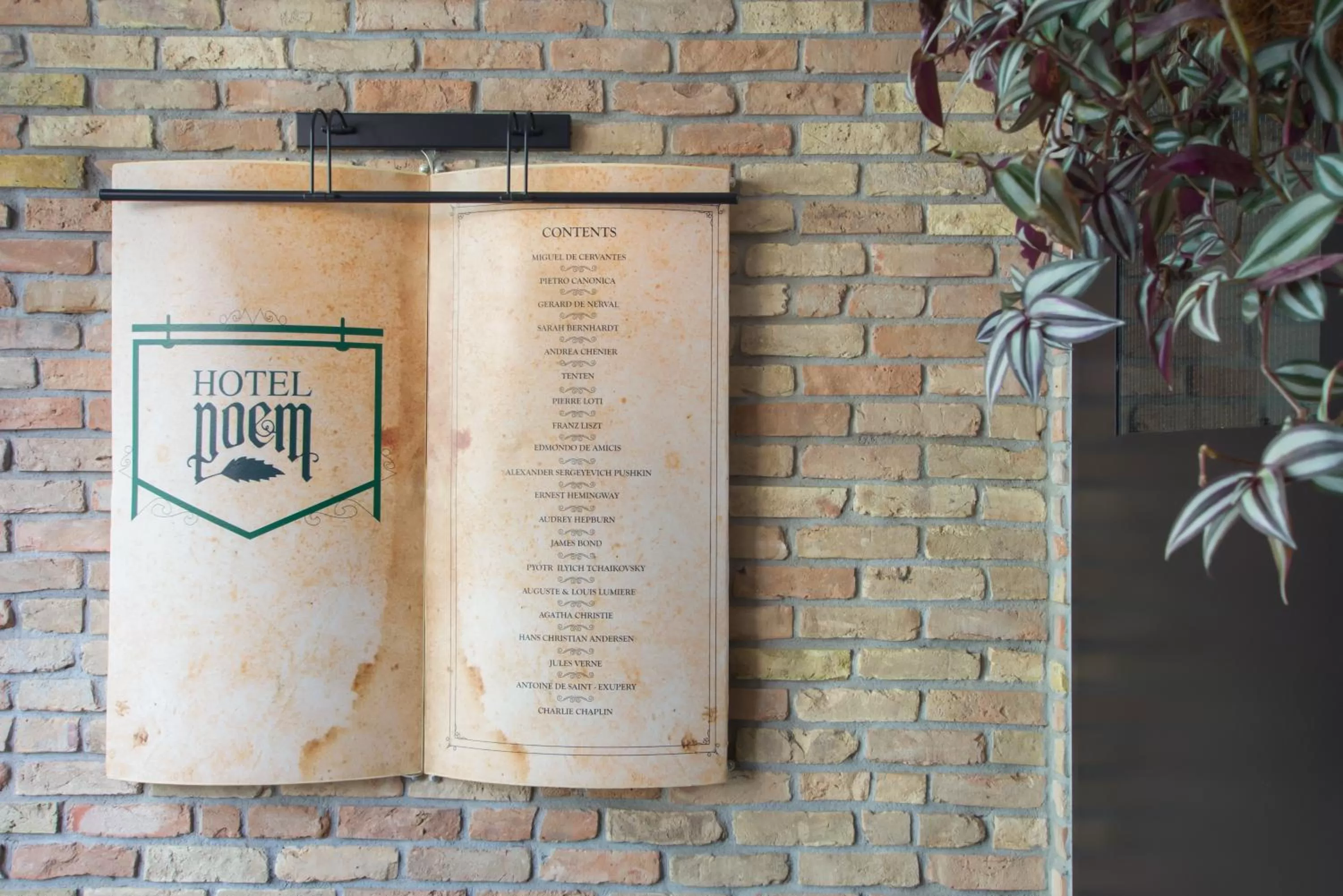 Property logo or sign in Hotel Poem