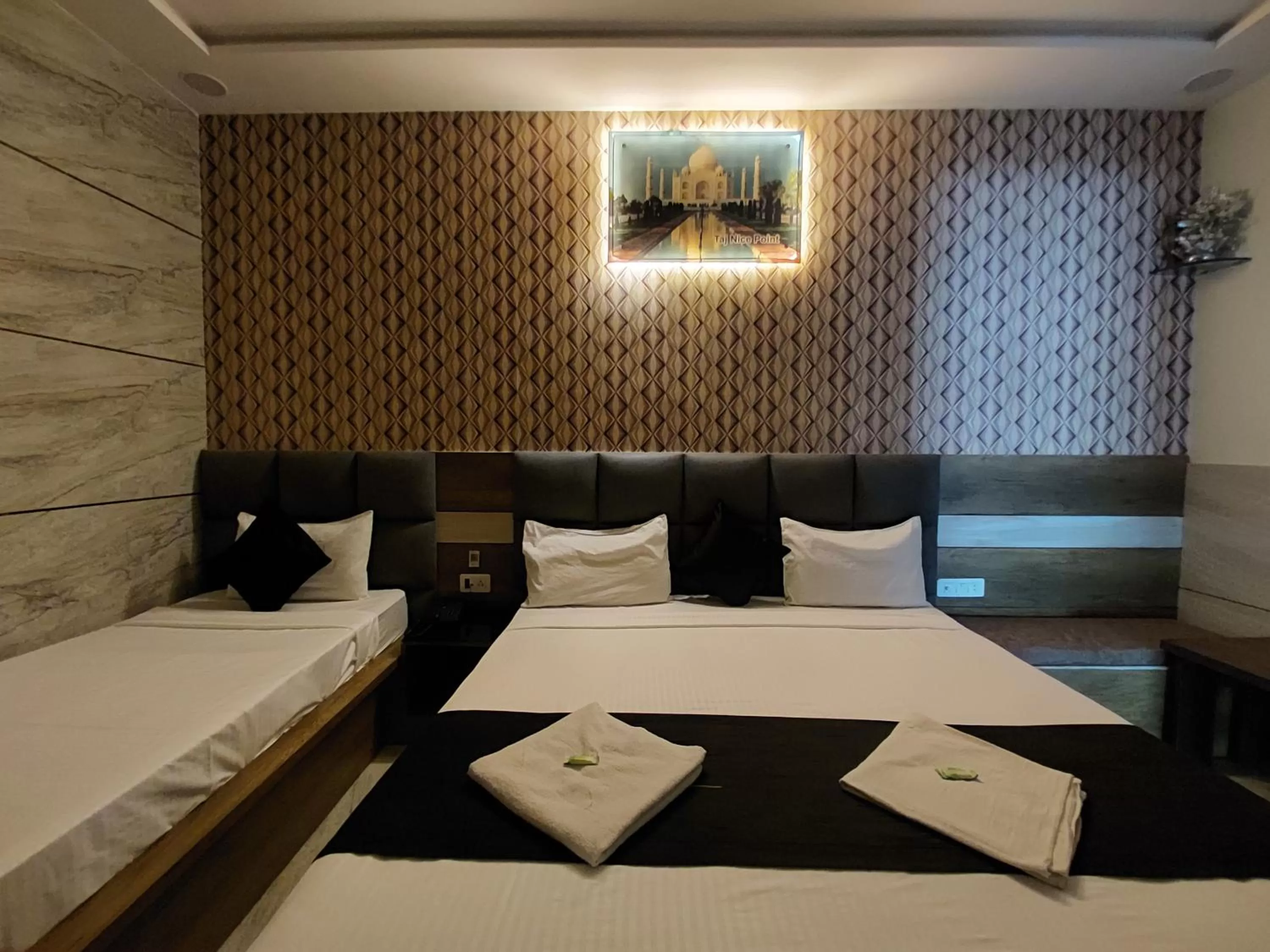 Bed in Taj Nice Point Manage by Taj Sunrise Group