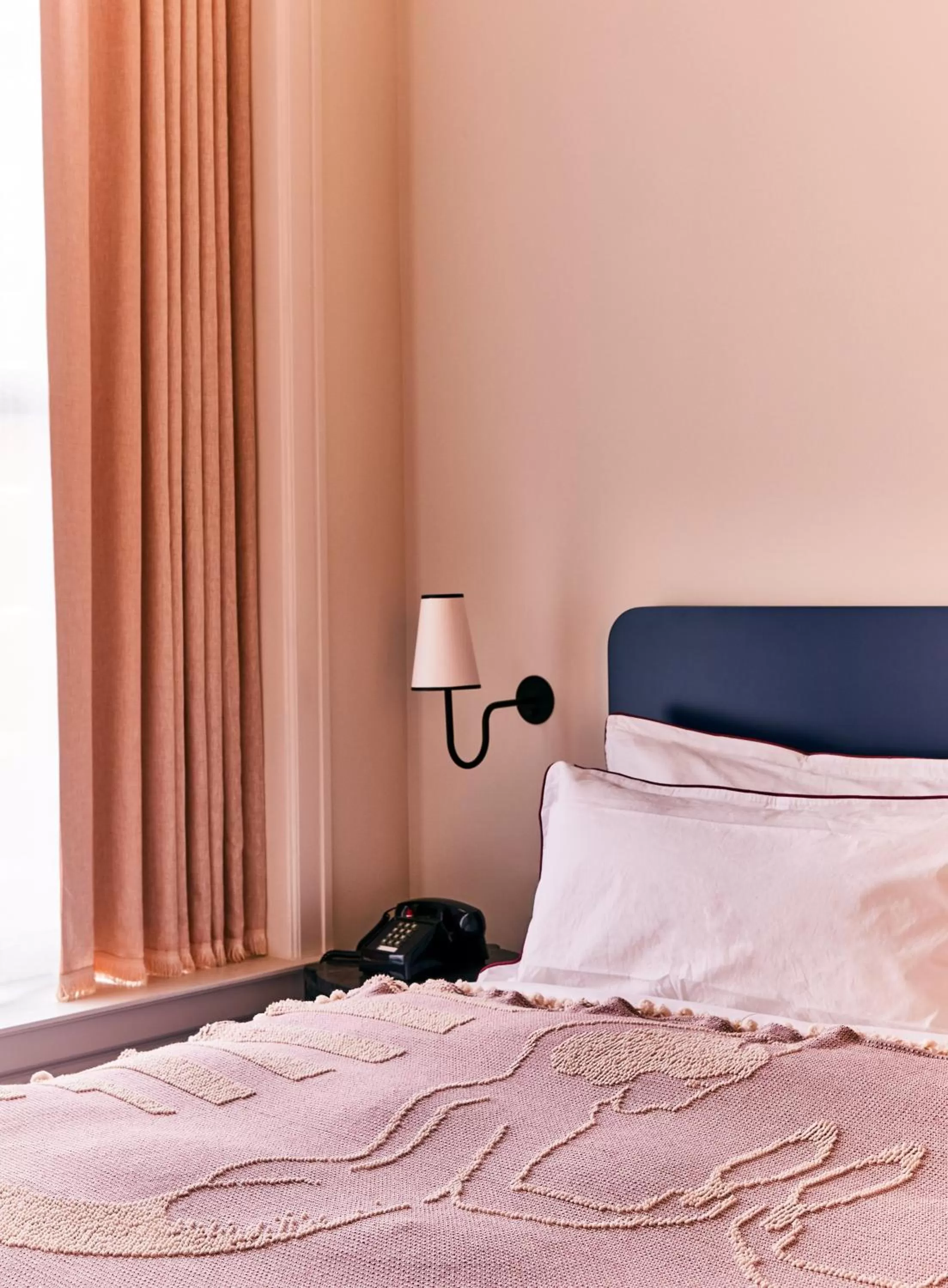 Bed in The Siren Hotel, an Ash Hotel