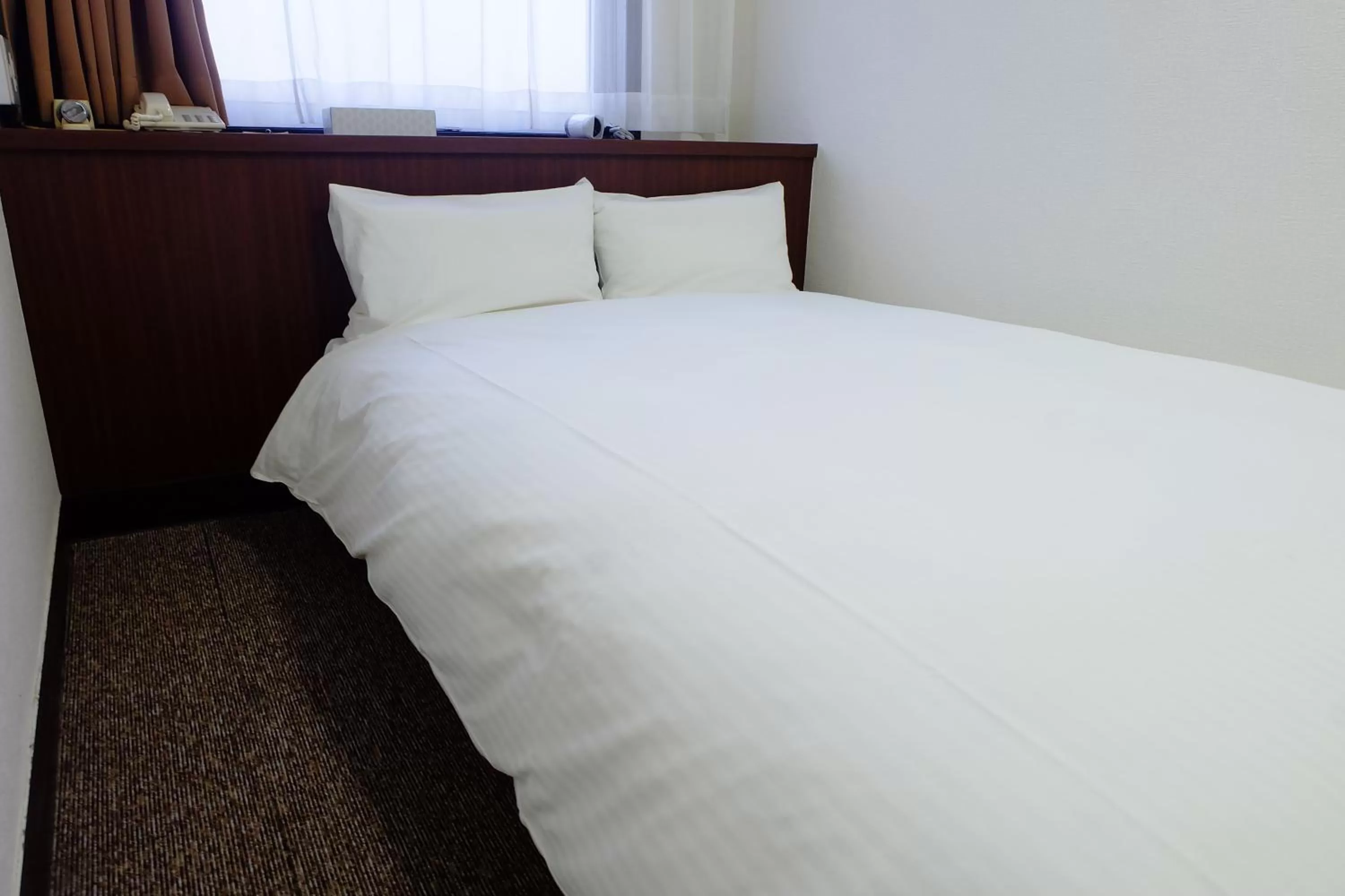 Bed in Tabist Hotel Tetora Hakodate Station