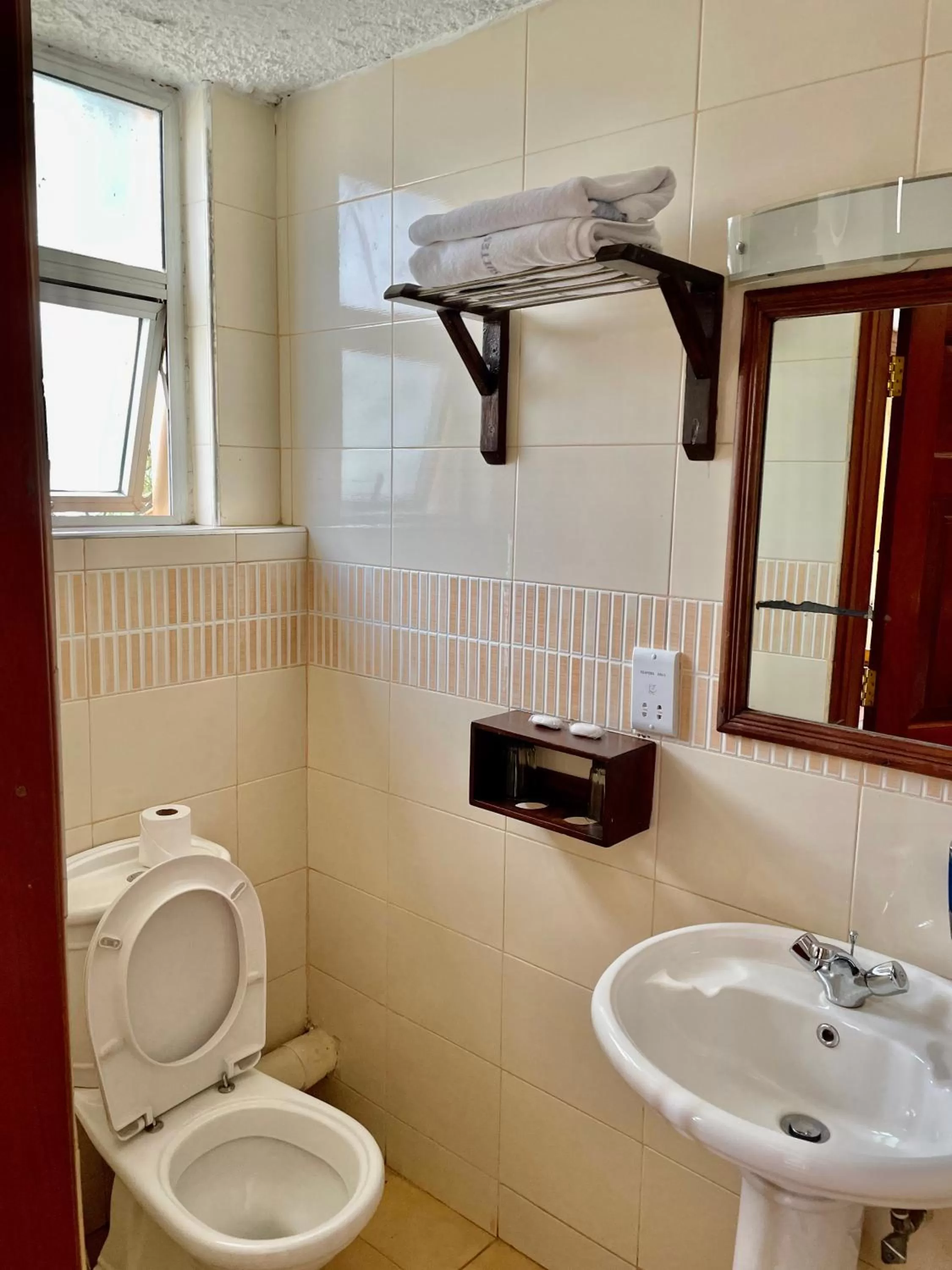 Toilet in Kenya Comfort Suites