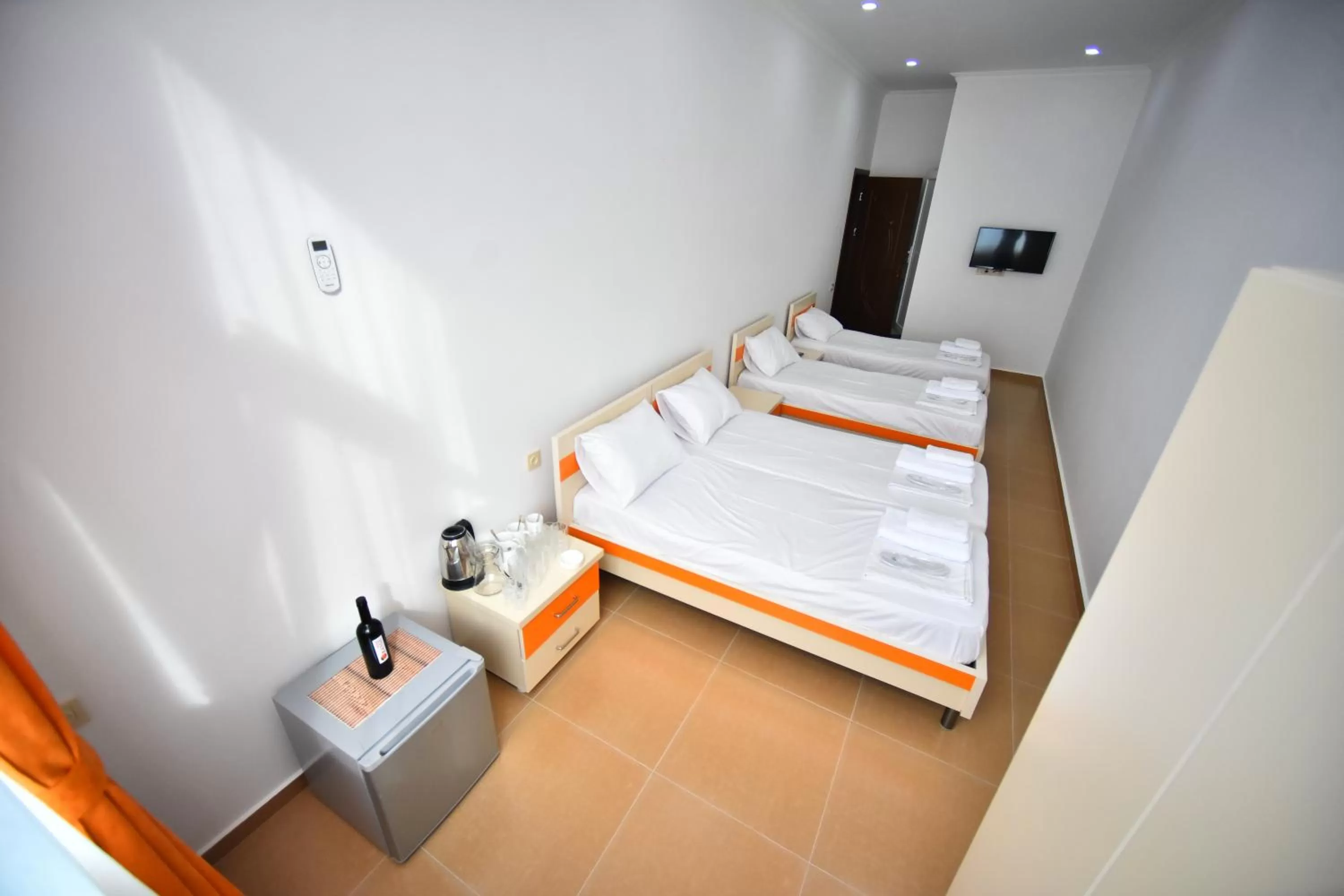 Bed in Orange Home Hotel