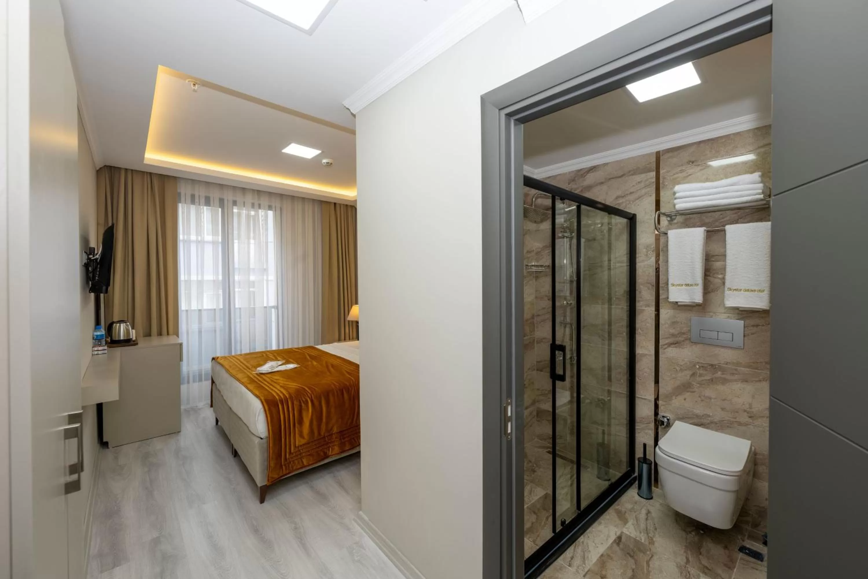 Bed in SKYSTAR DELUXE HOTEL