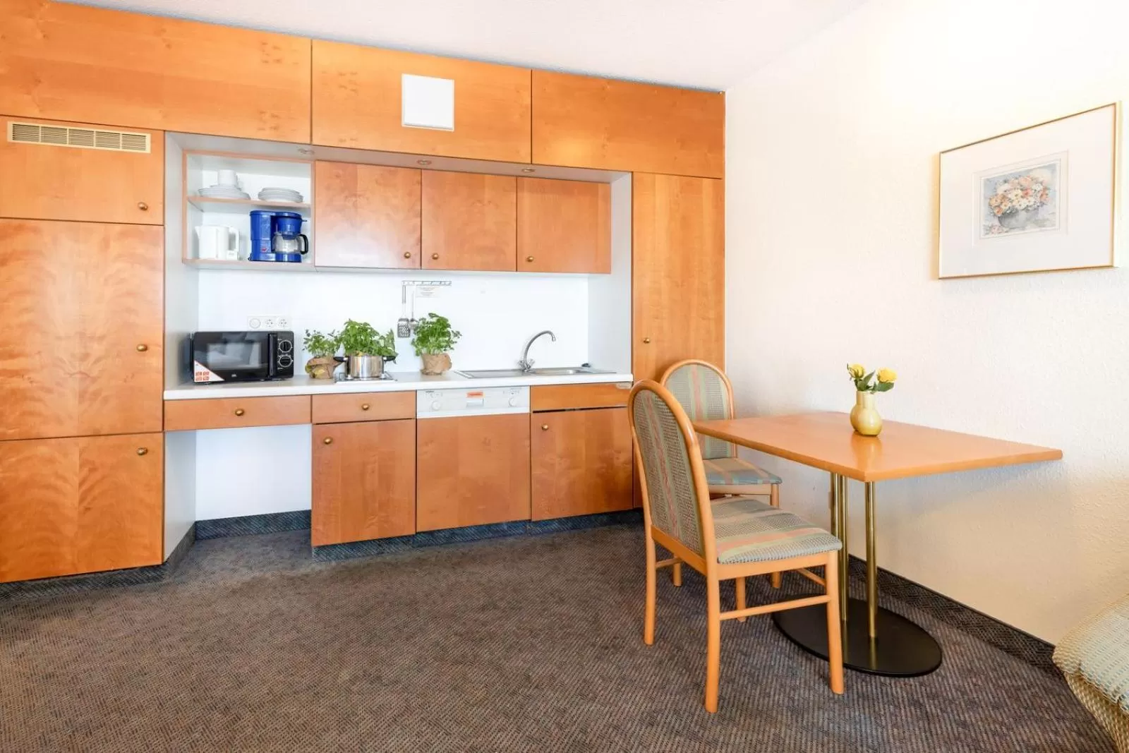 Kitchen or kitchenette in acora Leipzig Living the City